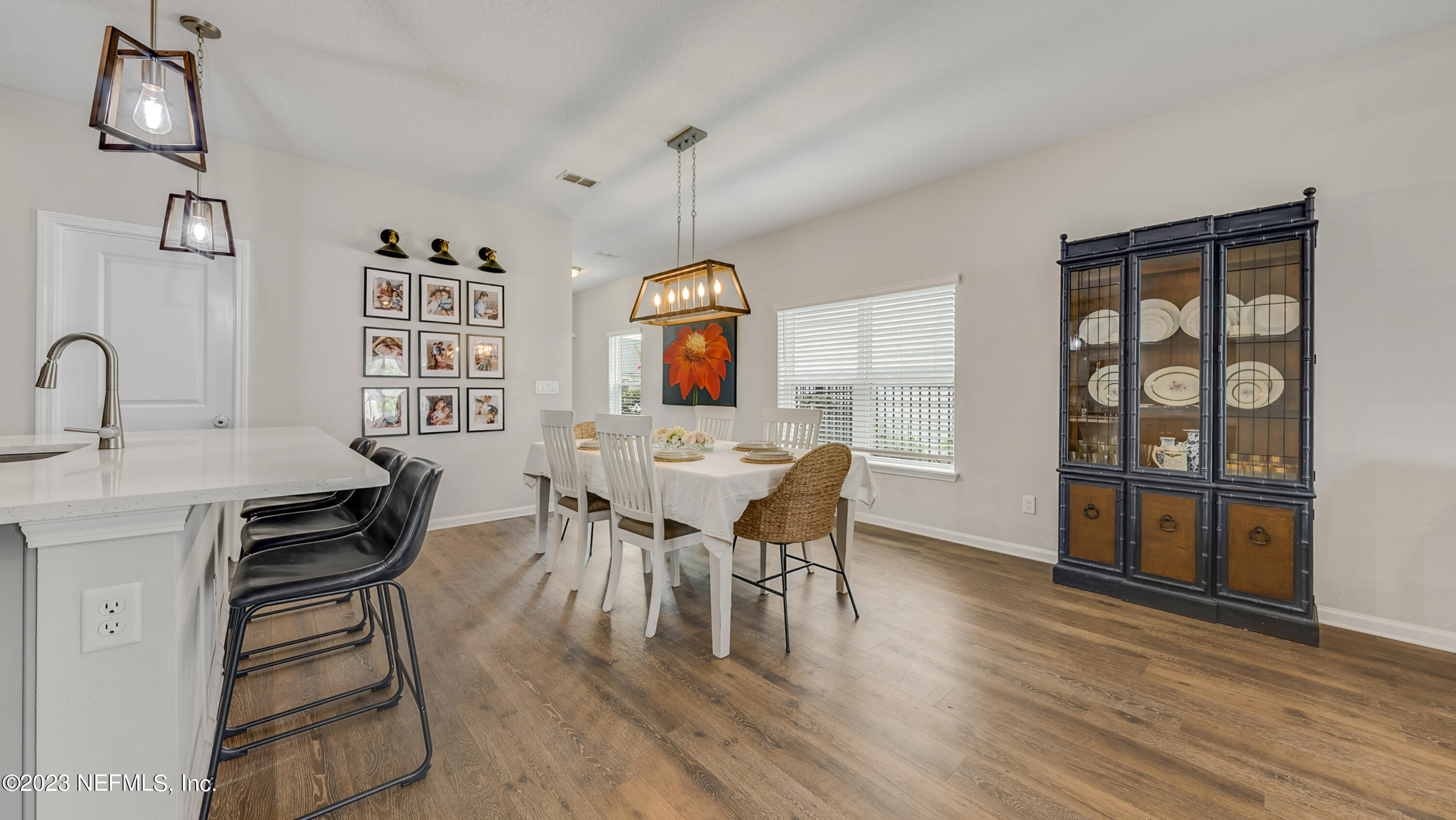 321 Beale Avenue St. Augustine, FL 32092 - Photo 12 of 35 a view of a dining room with furniture and wooden floor