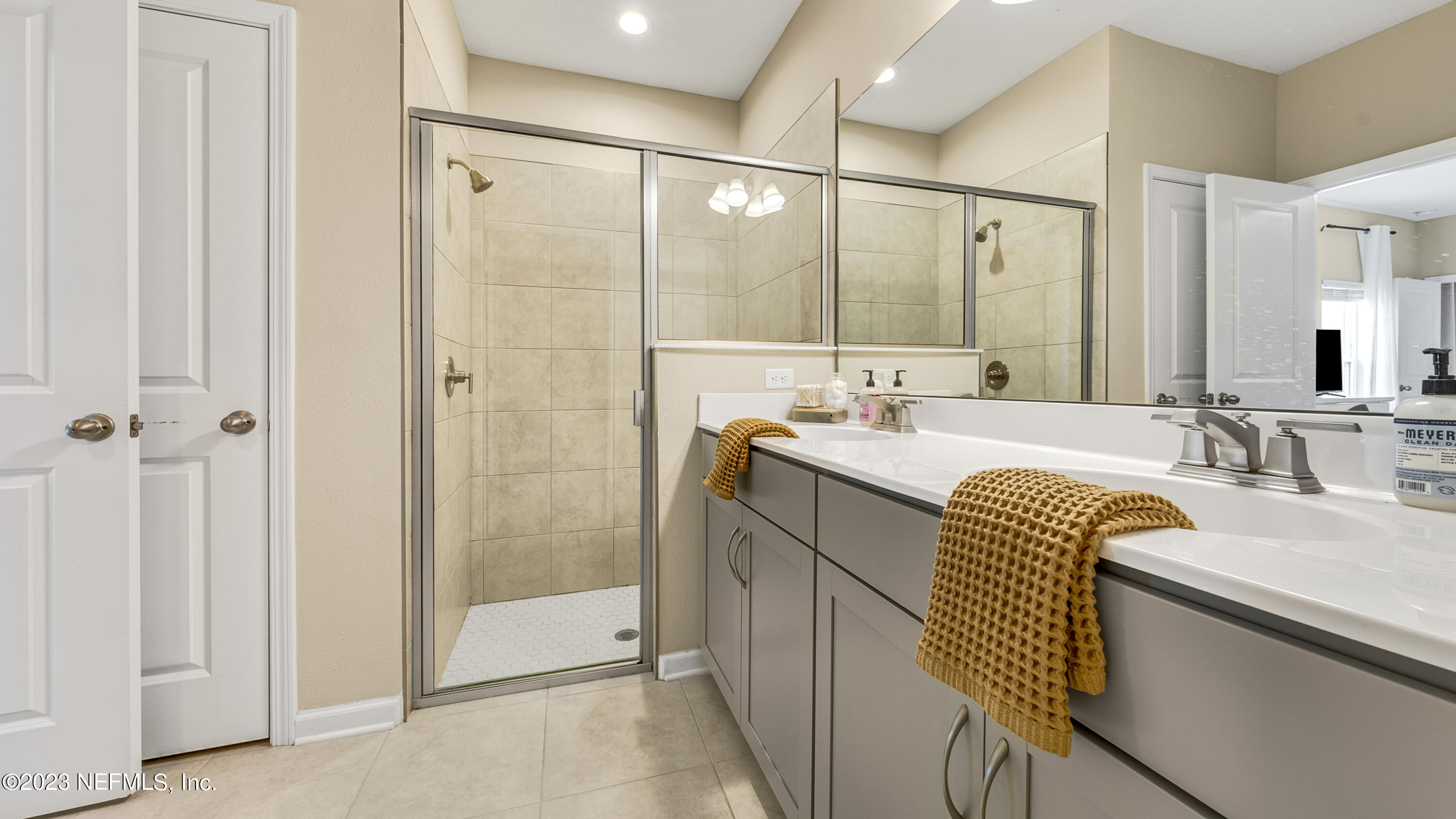 321 Beale Avenue St. Augustine, FL 32092 - Photo 13 of 35 a bathroom with a sink double vanity and a mirror