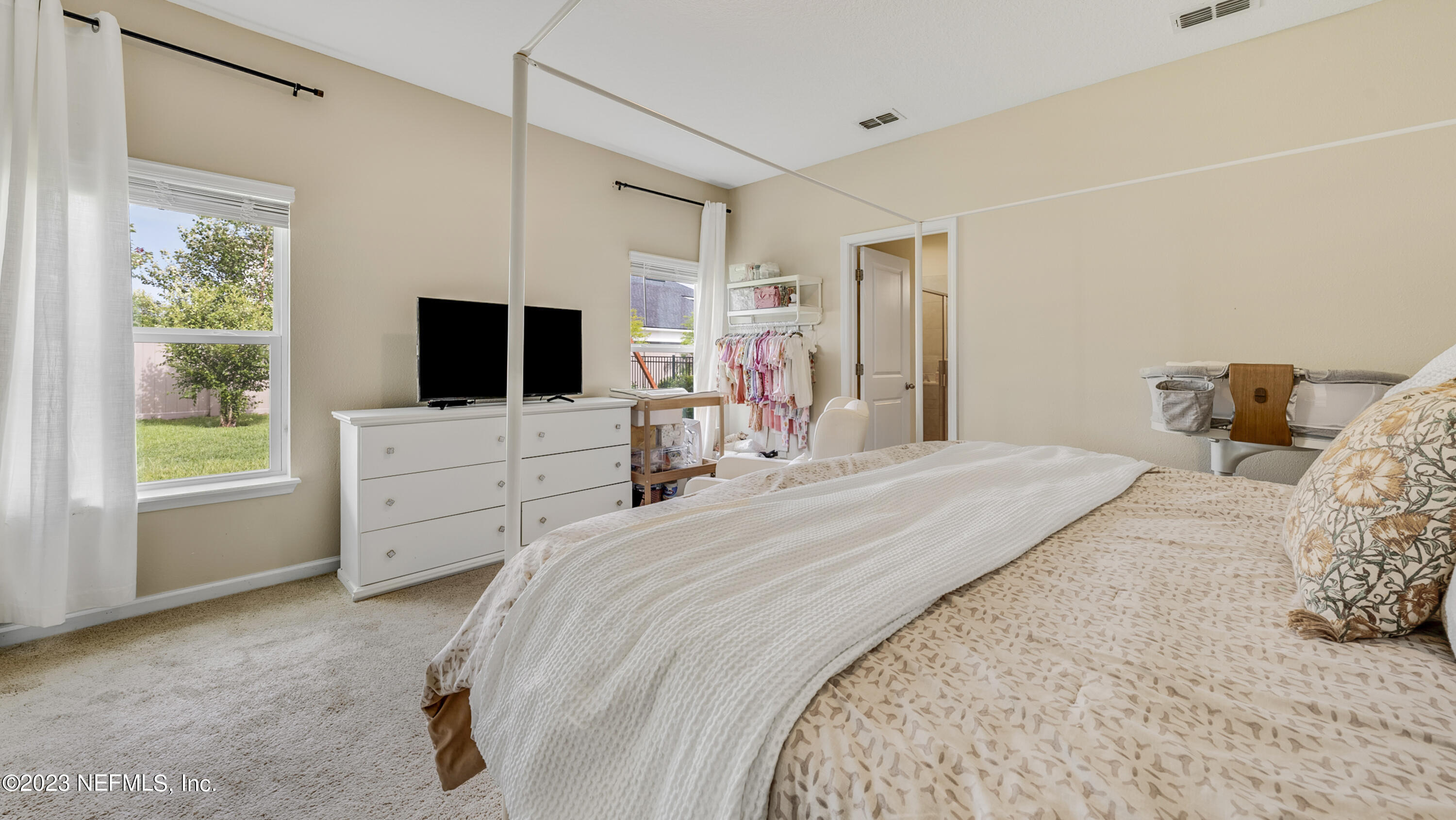 321 Beale Avenue St. Augustine, FL 32092 - Photo 14 of 35 a bedroom with bed tv and window