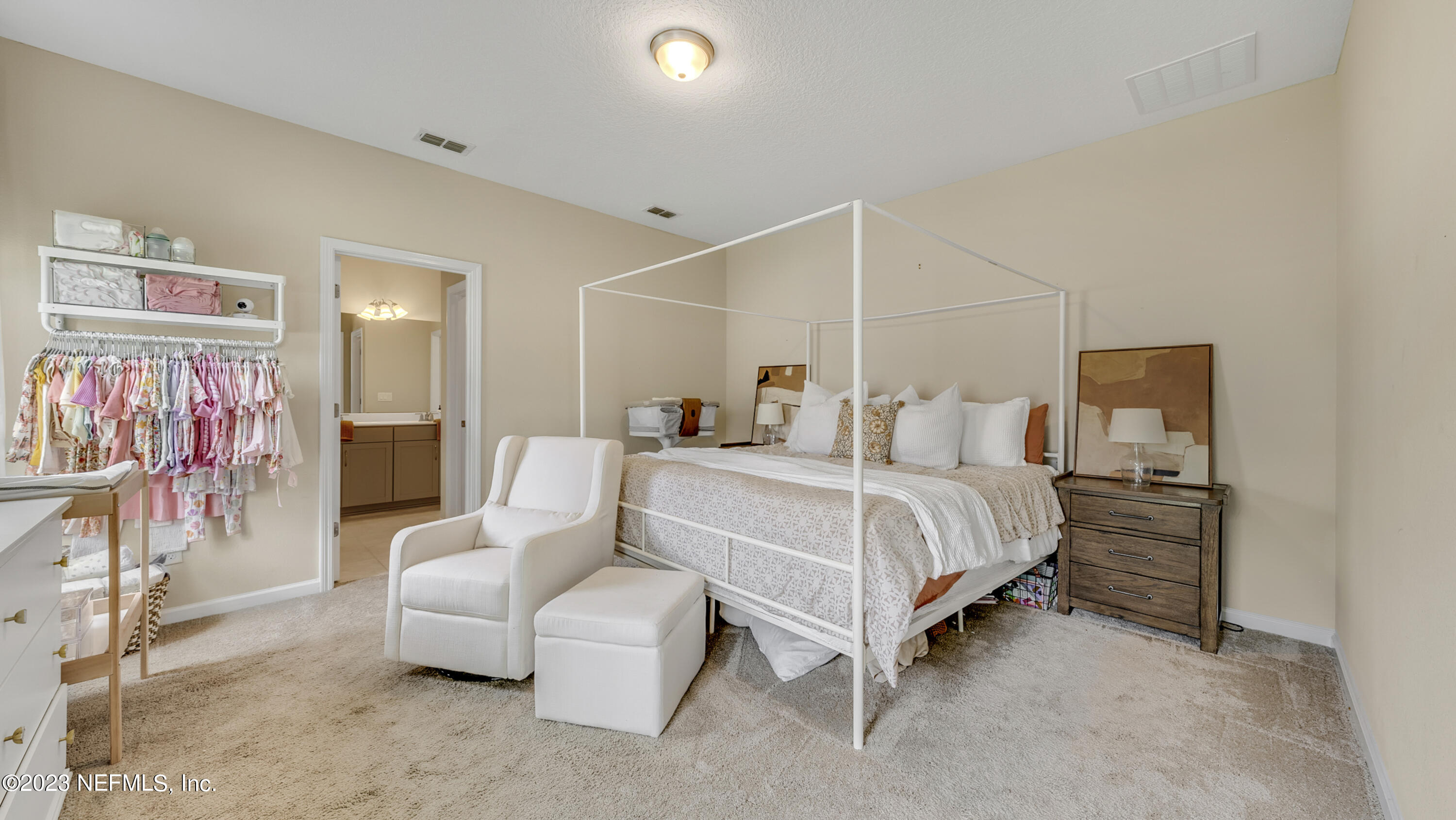 321 Beale Avenue St. Augustine, FL 32092 - Photo 16 of 35 a bedroom with a bed and lamp