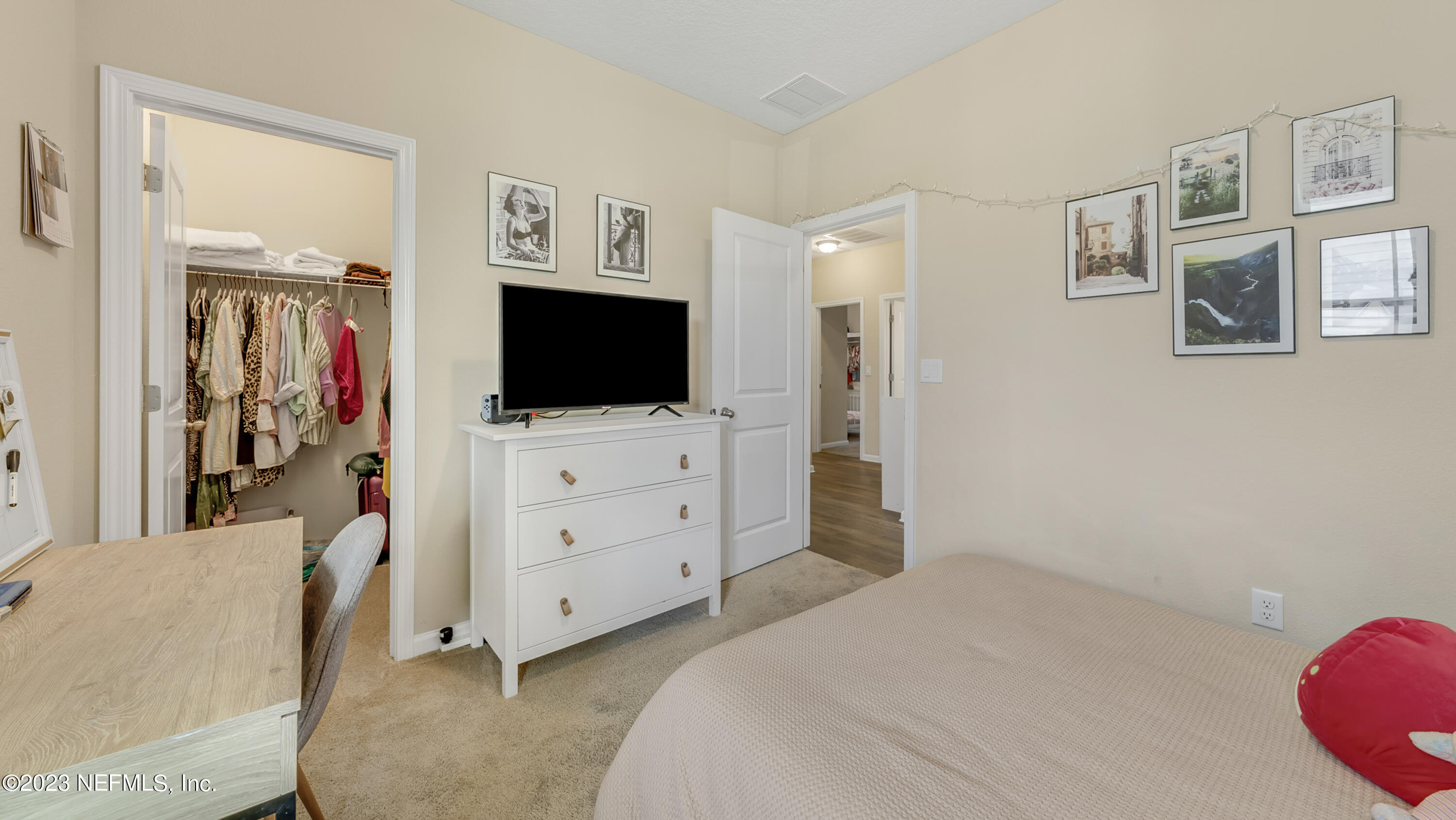 321 Beale Avenue St. Augustine, FL 32092 - Photo 19 of 35 a bedroom with a bed and flat screen tv