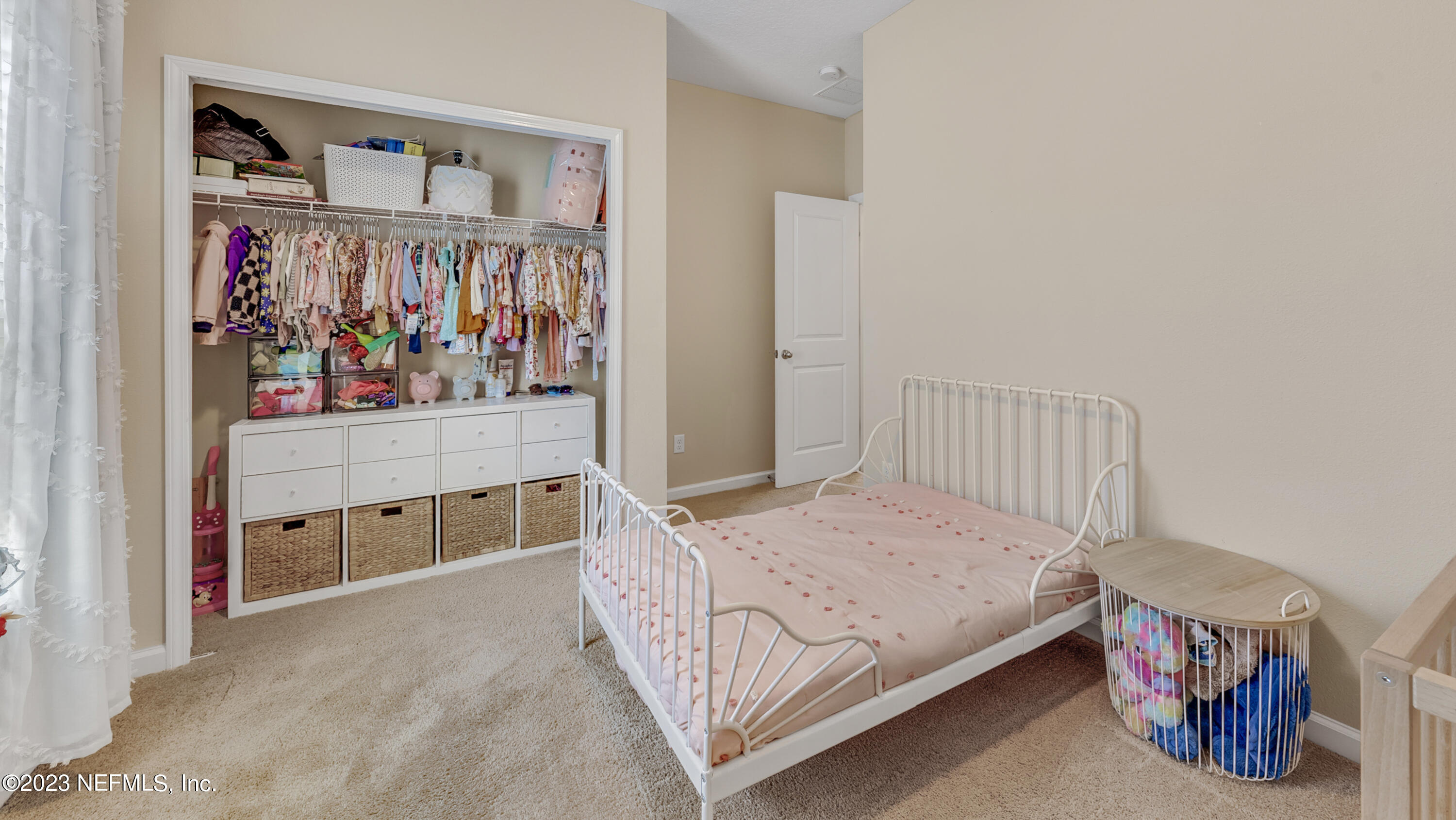 321 Beale Avenue St. Augustine, FL 32092 - Photo 20 of 35 a bedroom with a bed and a window