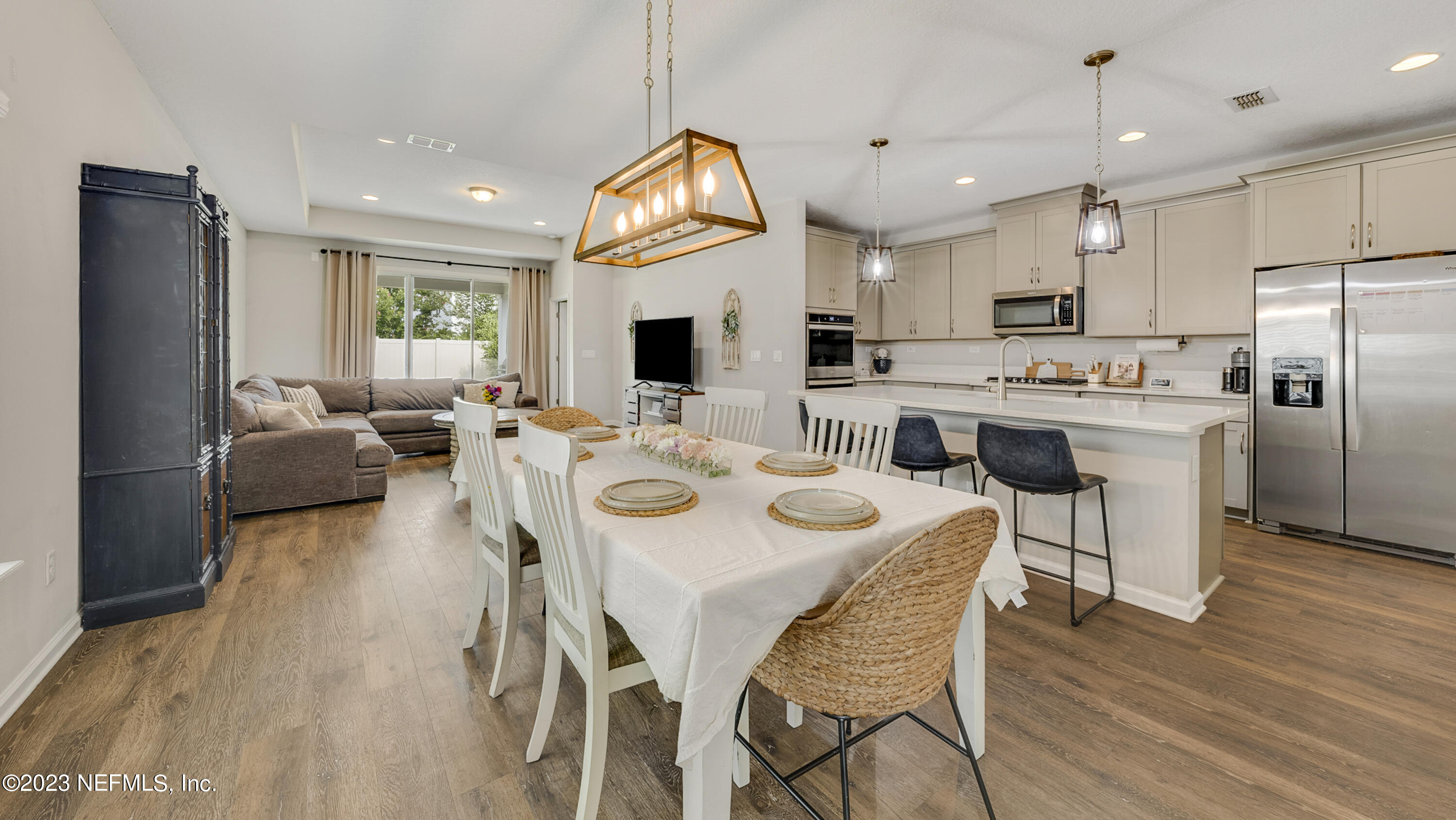 321 Beale Avenue St. Augustine, FL 32092 - Photo 2 of 35 a view of kitchen with refrigerator stove dining table and chairs