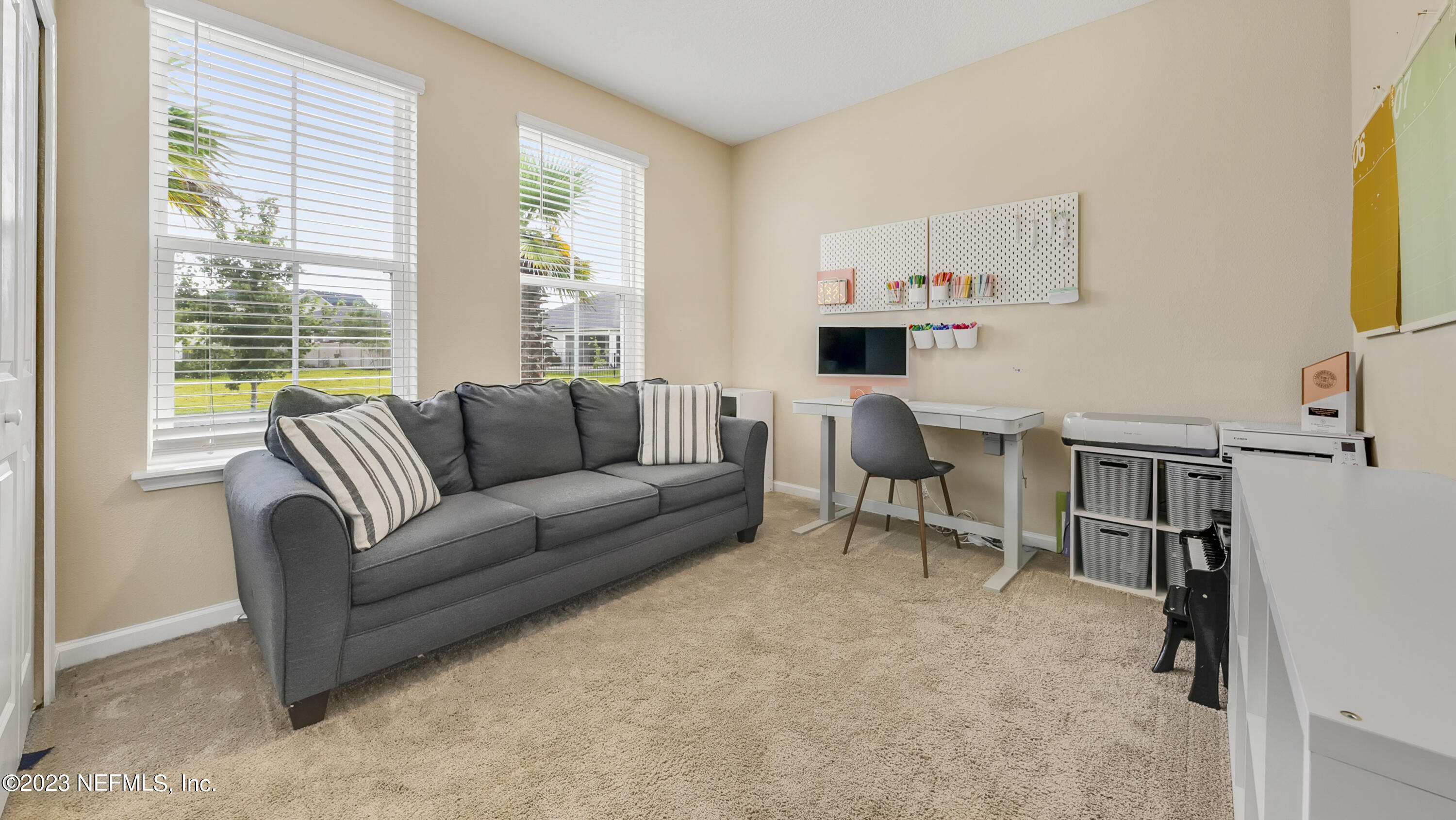 321 Beale Avenue St. Augustine, FL 32092 - Photo 21 of 35 a living room with furniture a fireplace and a large window