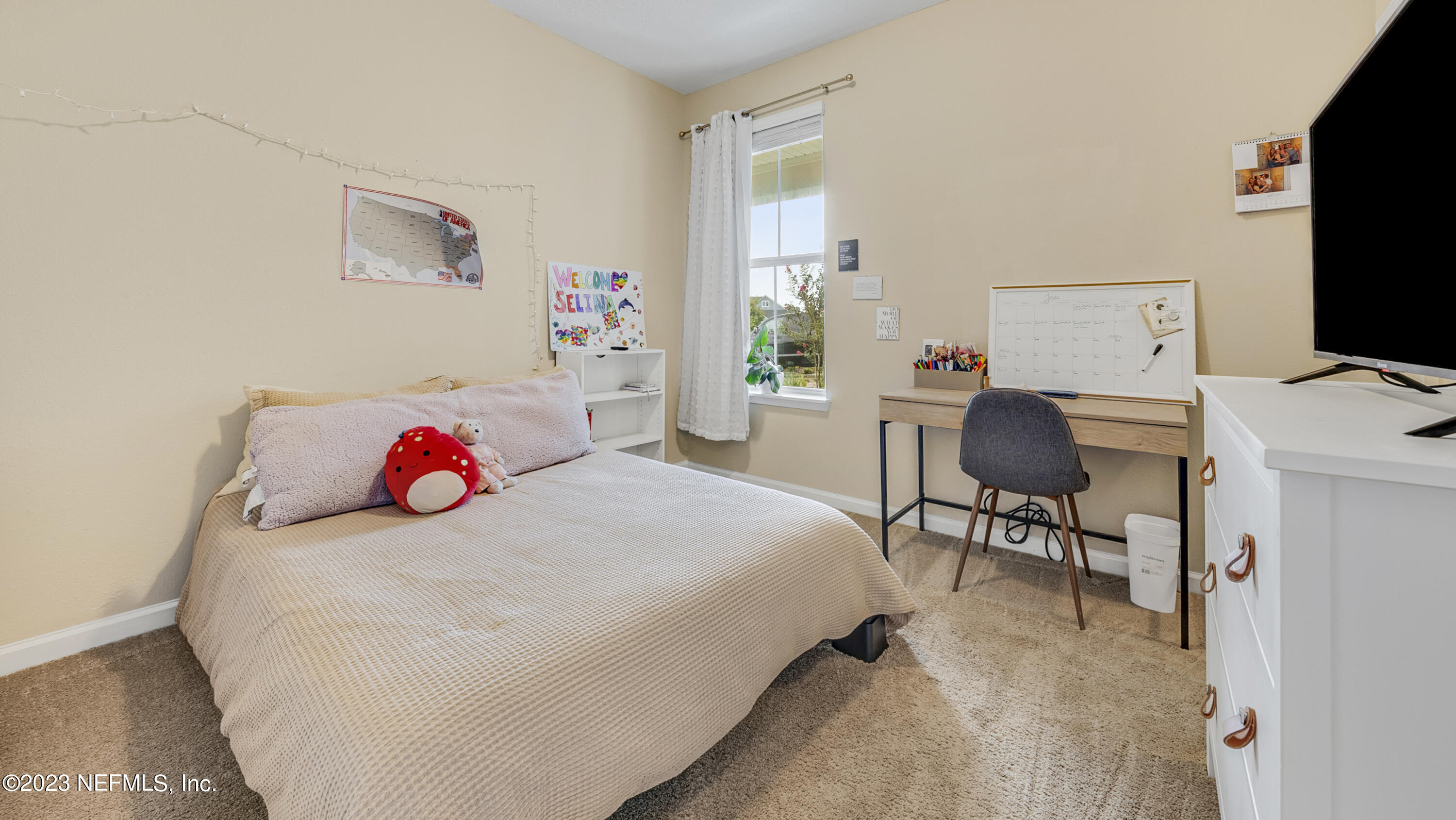 321 Beale Avenue St. Augustine, FL 32092 - Photo 22 of 35 a bedroom with a bed a desk and chair