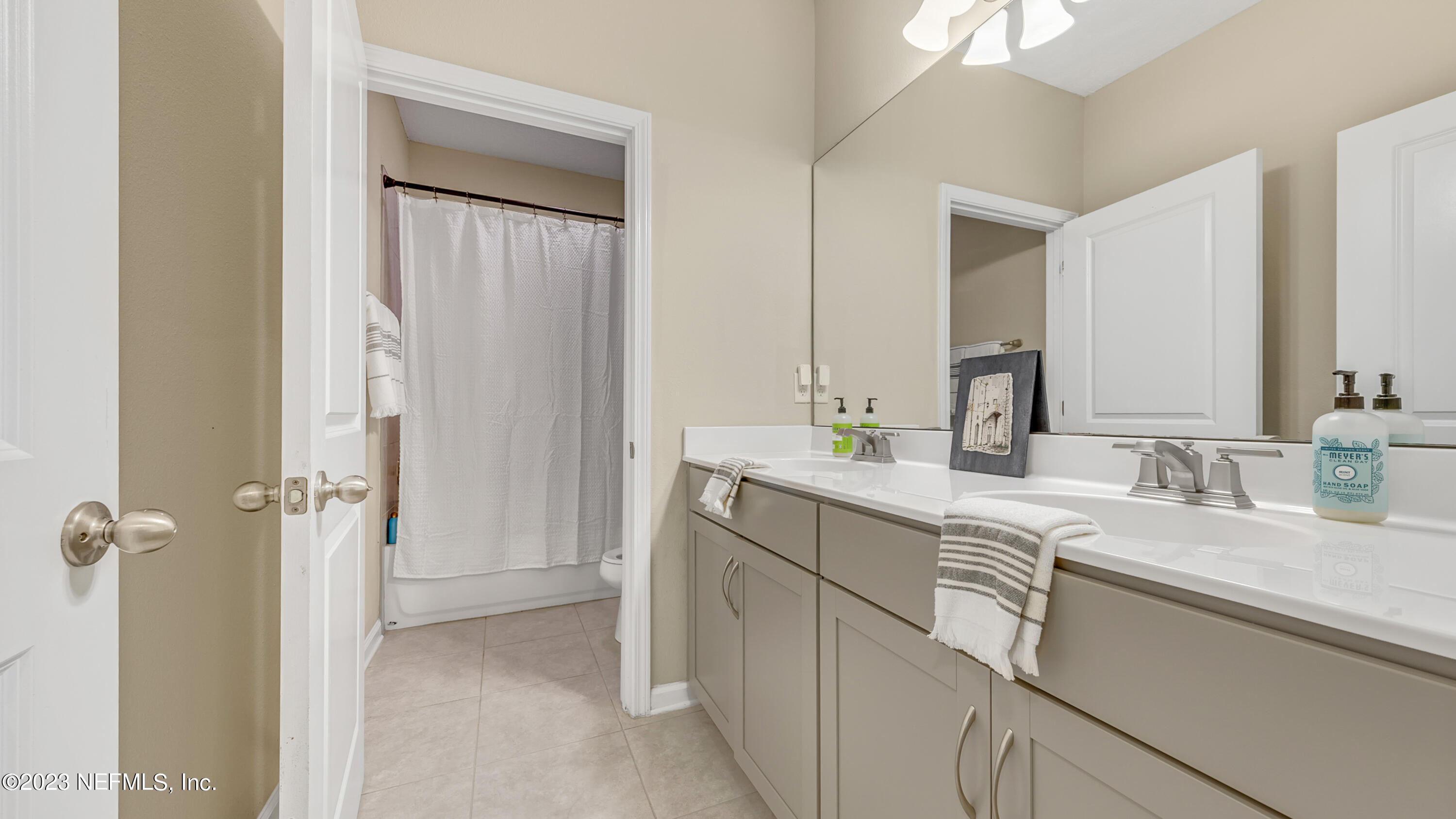 321 Beale Avenue St. Augustine, FL 32092 - Photo 24 of 35 a bathroom with a double vanity sink mirror and