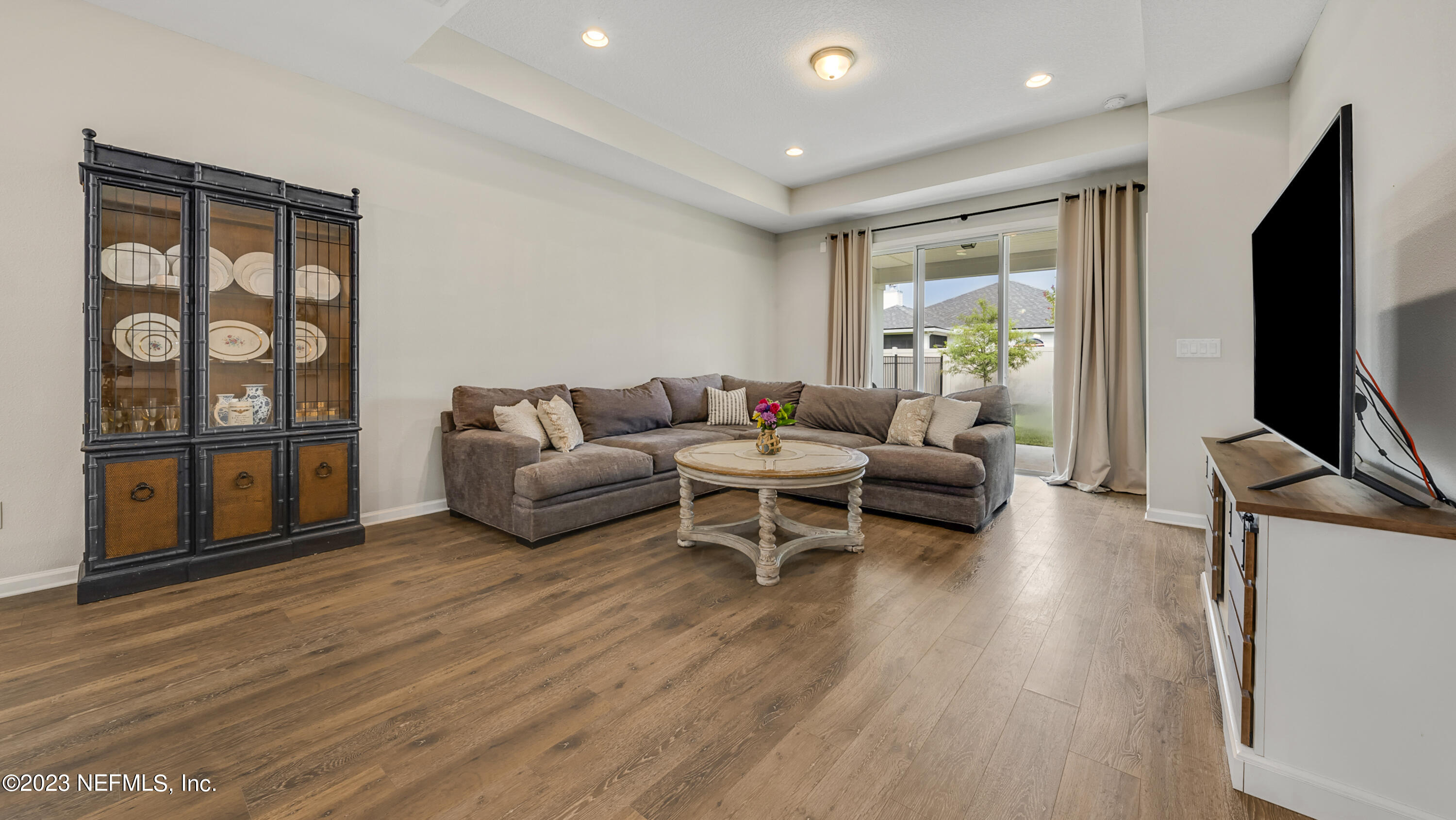 321 Beale Avenue St. Augustine, FL 32092 - Photo 6 of 35 a living room with furniture and a flat screen tv