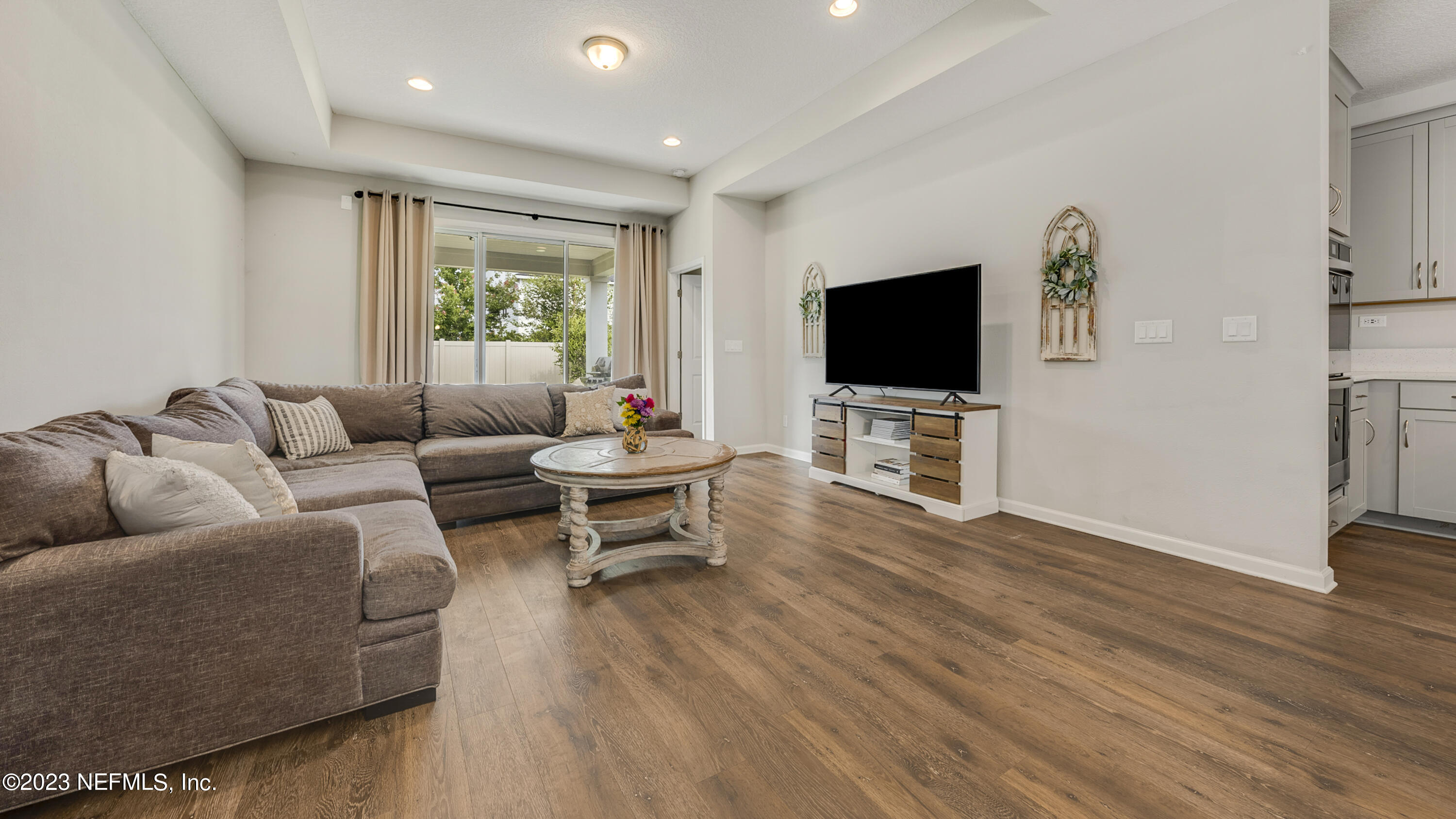 321 Beale Avenue St. Augustine, FL 32092 - Photo 7 of 35 a living room with furniture and a flat screen tv