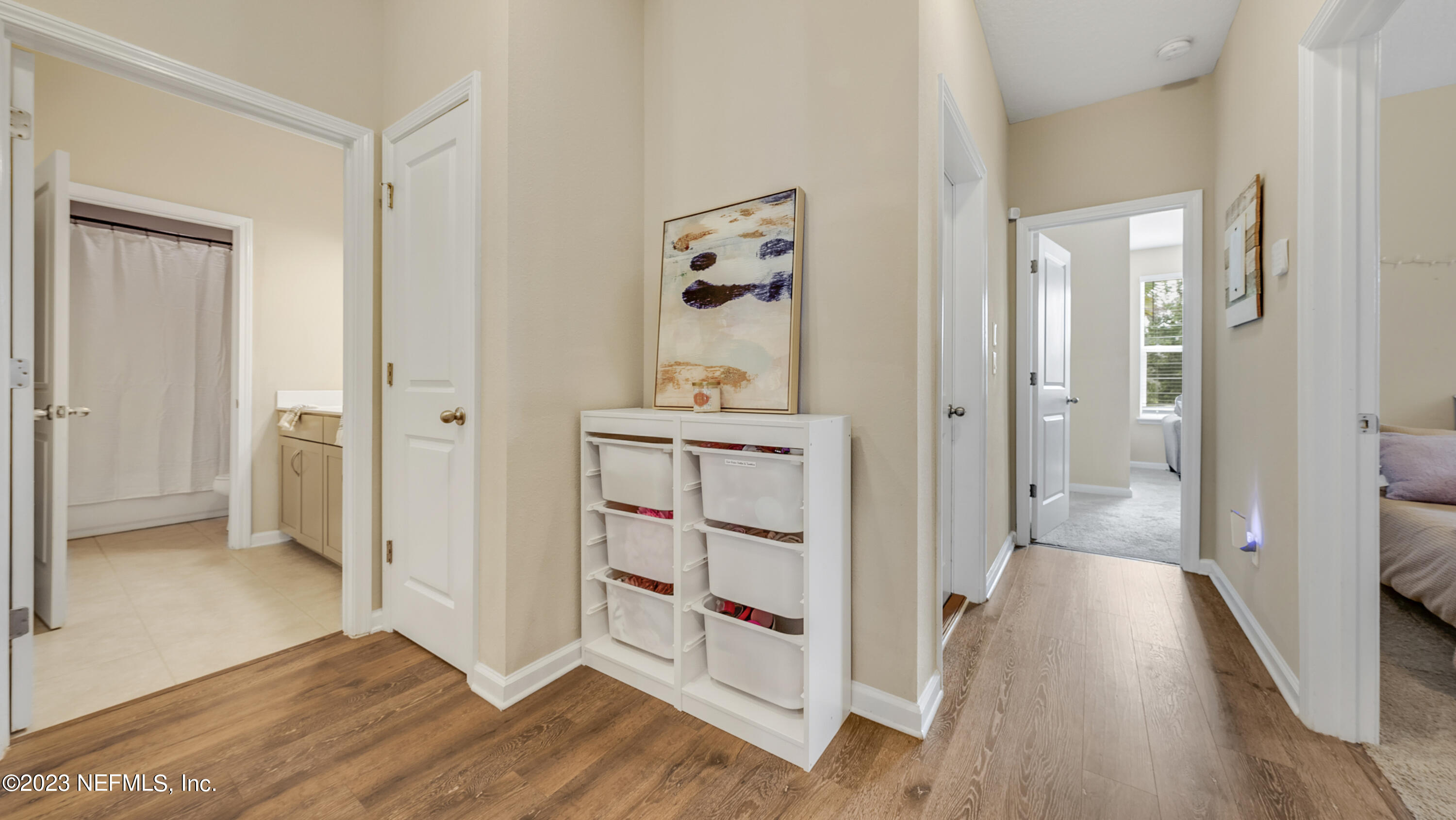 321 Beale Avenue St. Augustine, FL 32092 - Photo 10 of 35 a view of a hallway with wooden floor and cabinet