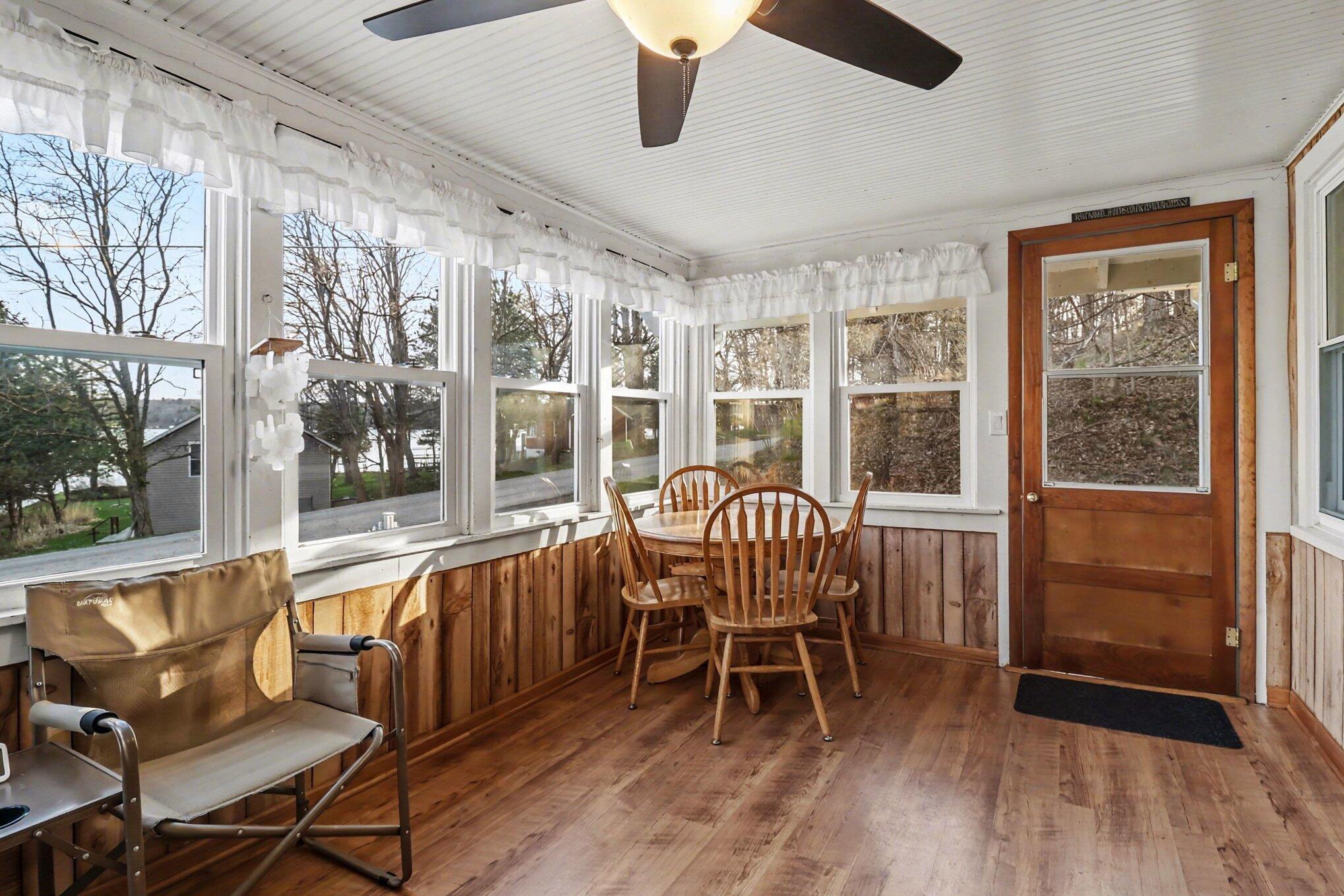 5989 Barnhart Road Ludington, MI 49431 - Photo 23 of 56 enclosed porch with lake views