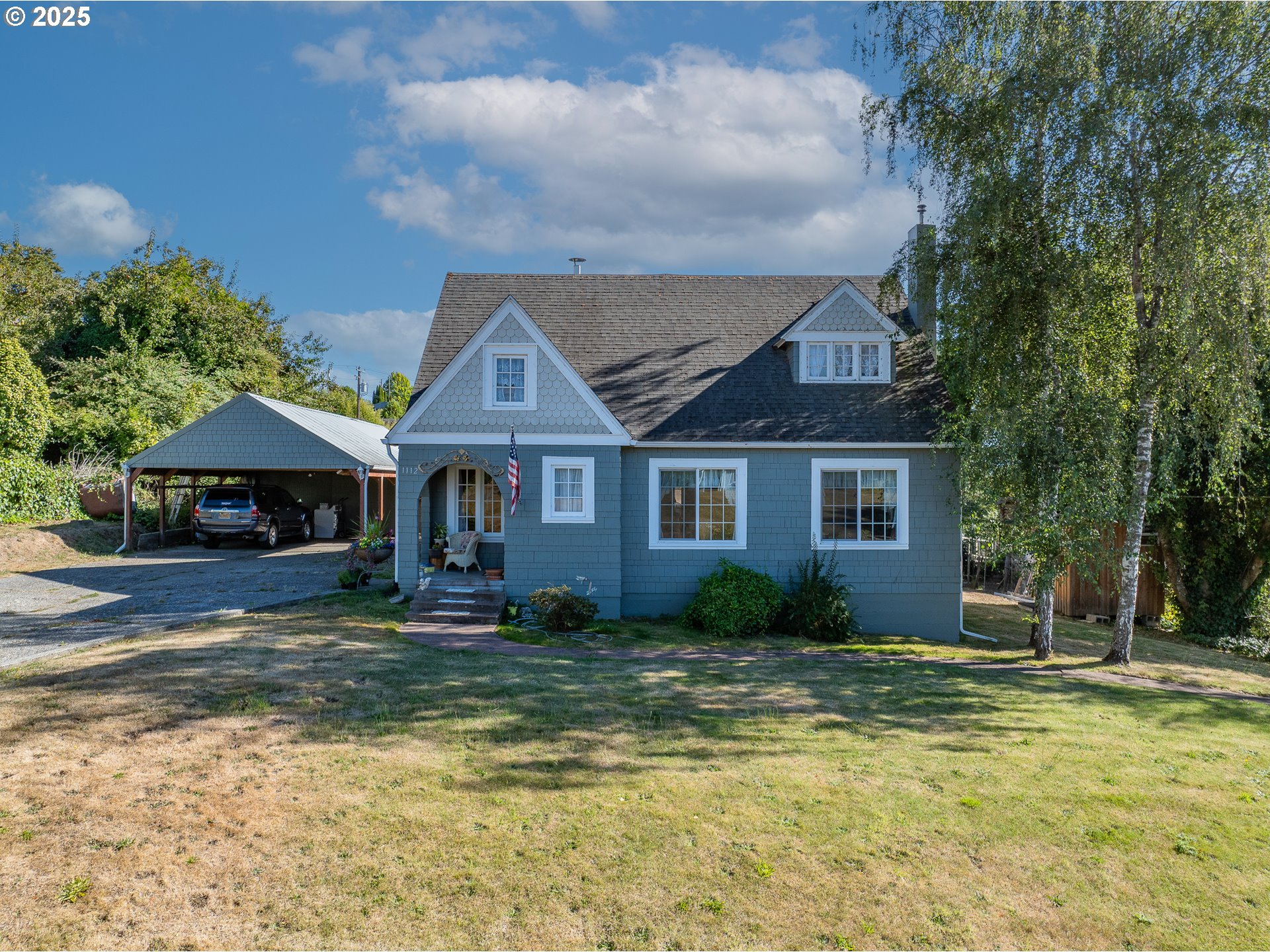 1112 Spruce Street Myrtle Point, OR 97458 - Photo 1 of 47 a front view of a house with garden