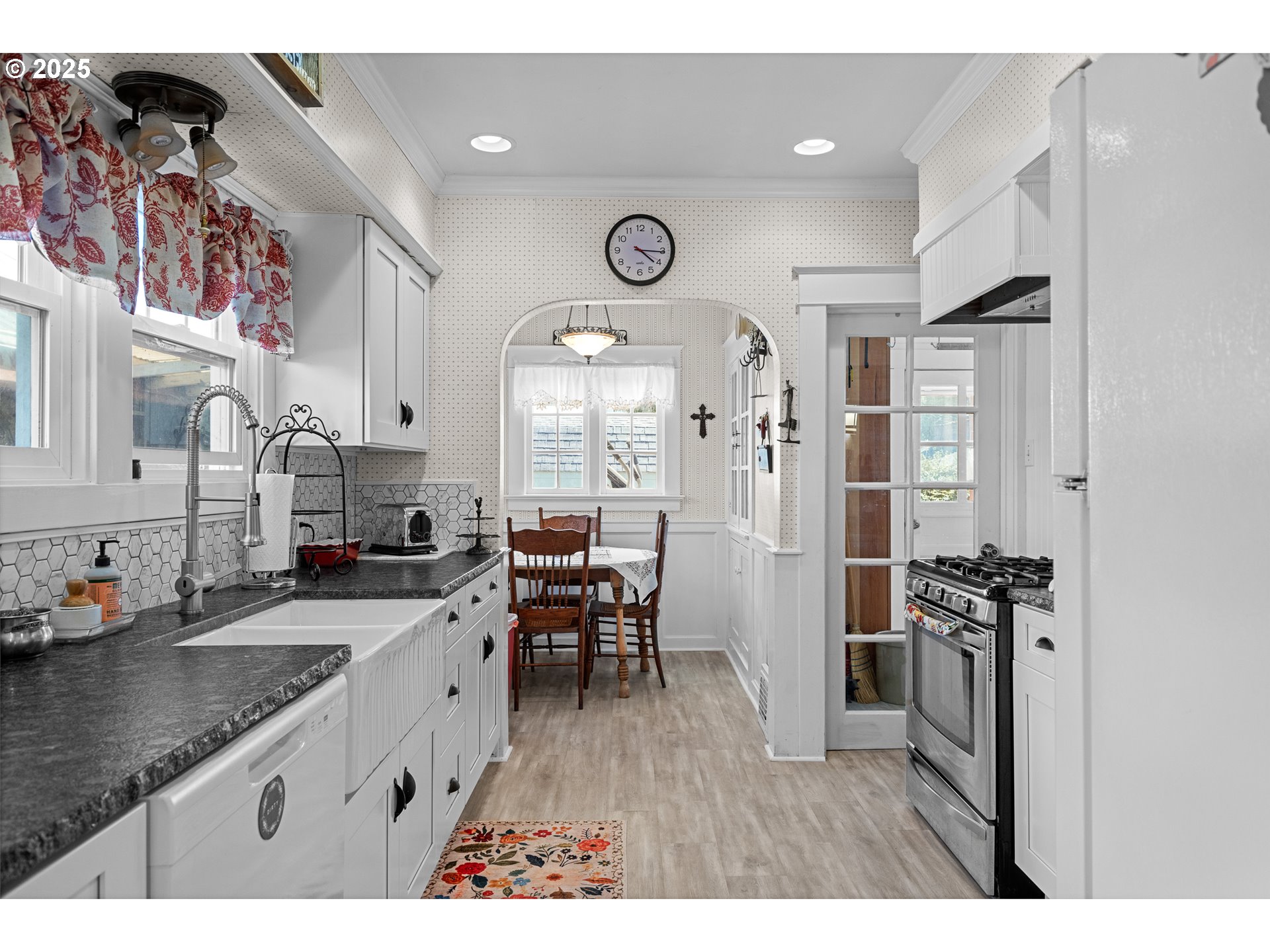 1112 Spruce Street Myrtle Point, OR 97458 - Photo 17 of 47 a open kitchen with stainless steel appliances granite countertop a stove a sink dishwasher and a refrigerator with wooden floor