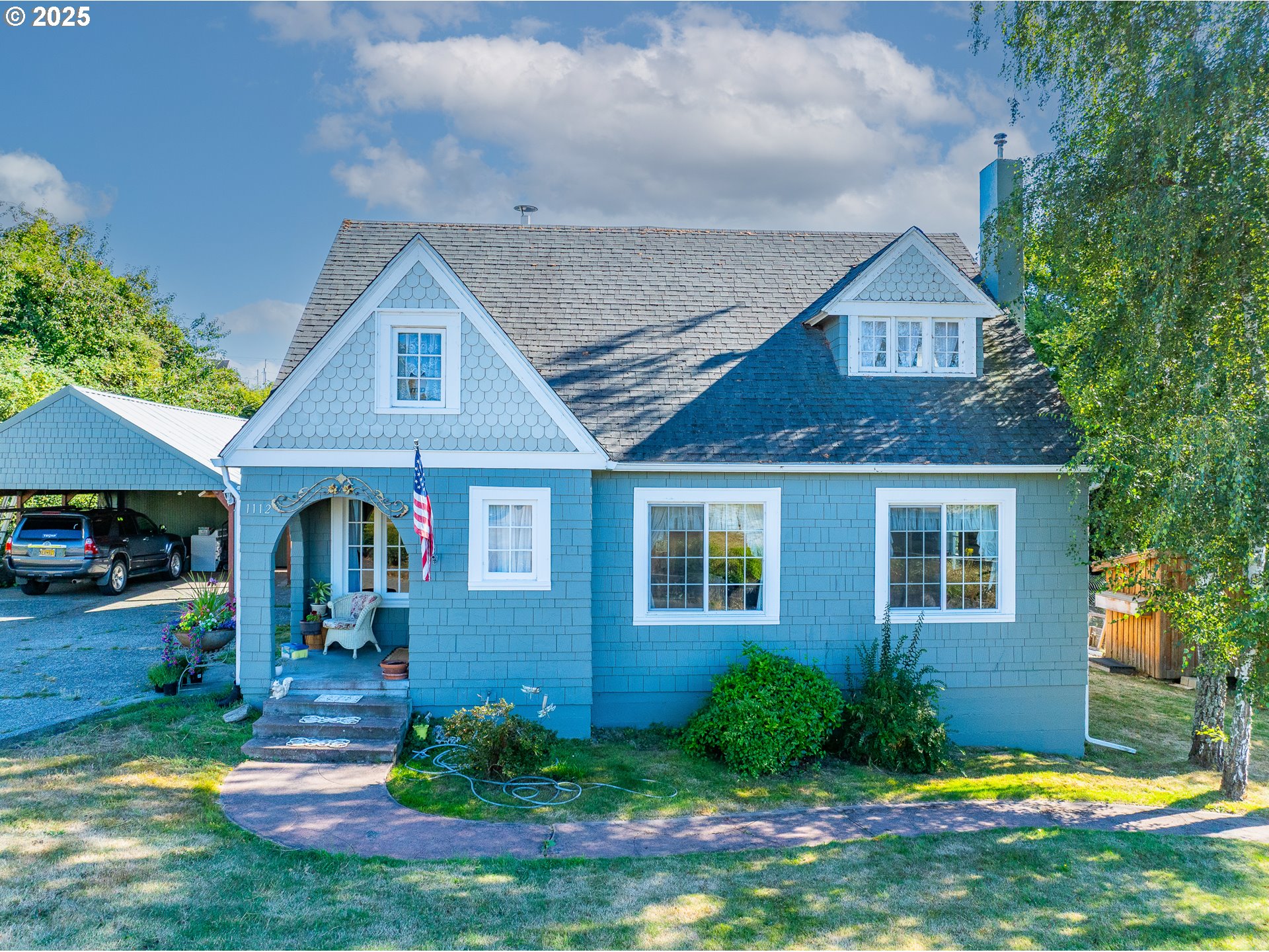 1112 Spruce Street Myrtle Point, OR 97458 - Photo 2 of 47 a front view of a house with garden