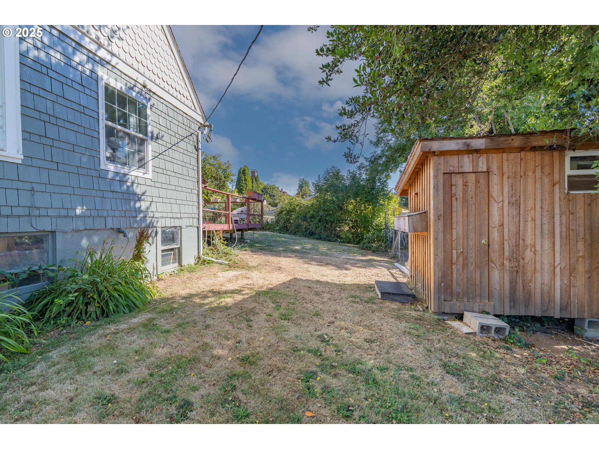 1112 Spruce Street Myrtle Point, OR 97458 - Photo 7 of 47 a view of backyard of house with wooden fence