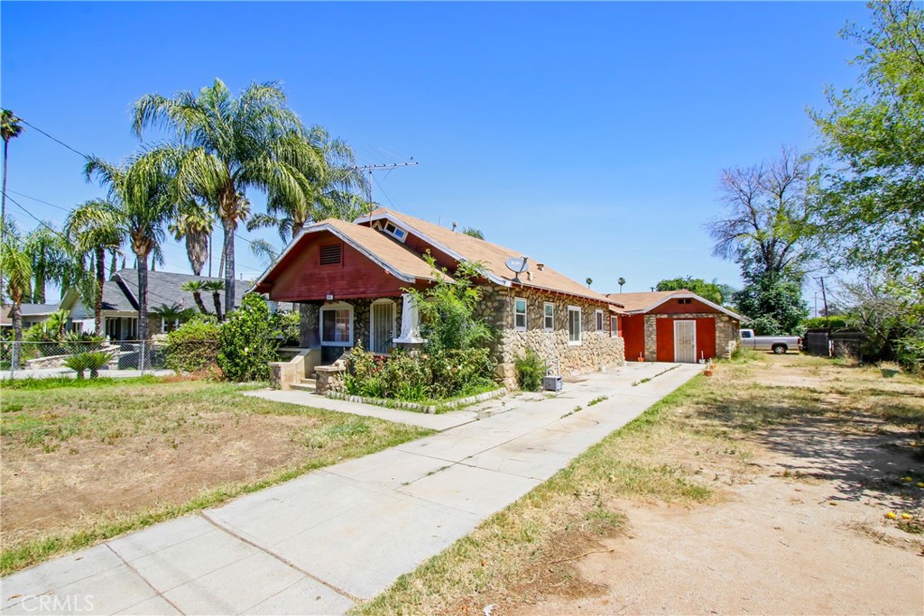 3463 Washington Street Riverside, CA 92504 - Photo 2 of 24 a front view of a house with a yard