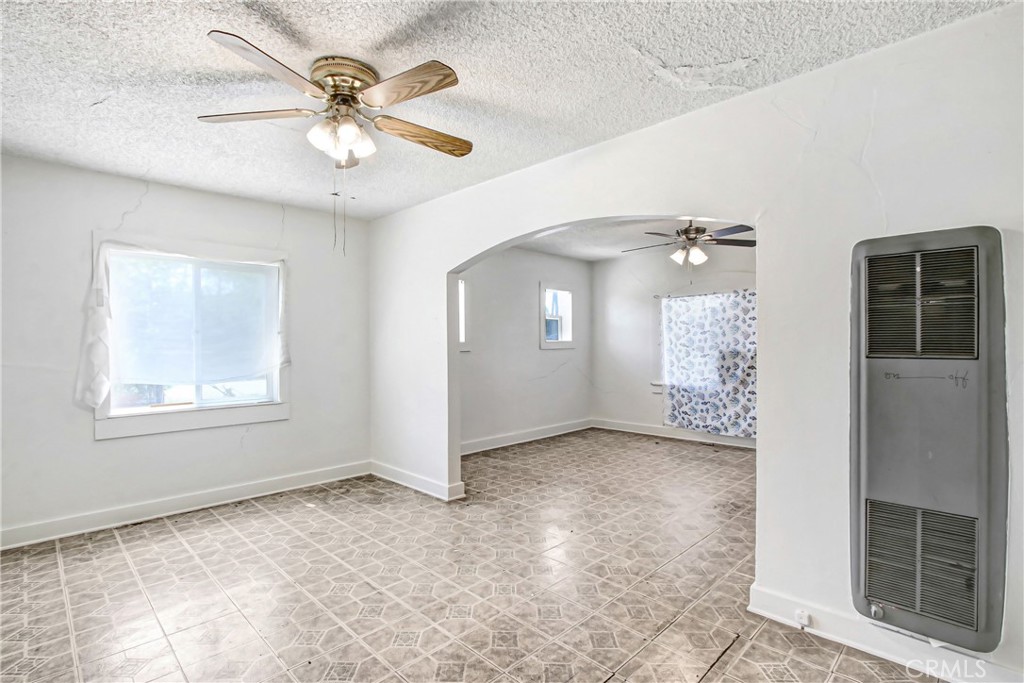 3463 Washington Street Riverside, CA 92504 - Photo 9 of 24 an empty room with windows and fan