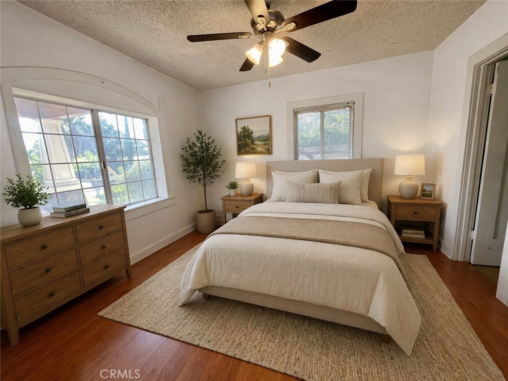3463 Washington Street Riverside, CA 92504 - Photo 10 of 24 a bedroom with a large bed and a window