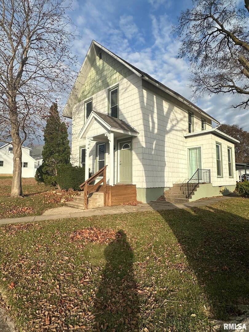323 Lincoln Street Miles, IA 52064 - Photo 27 of 34 a front view of a house with a yard