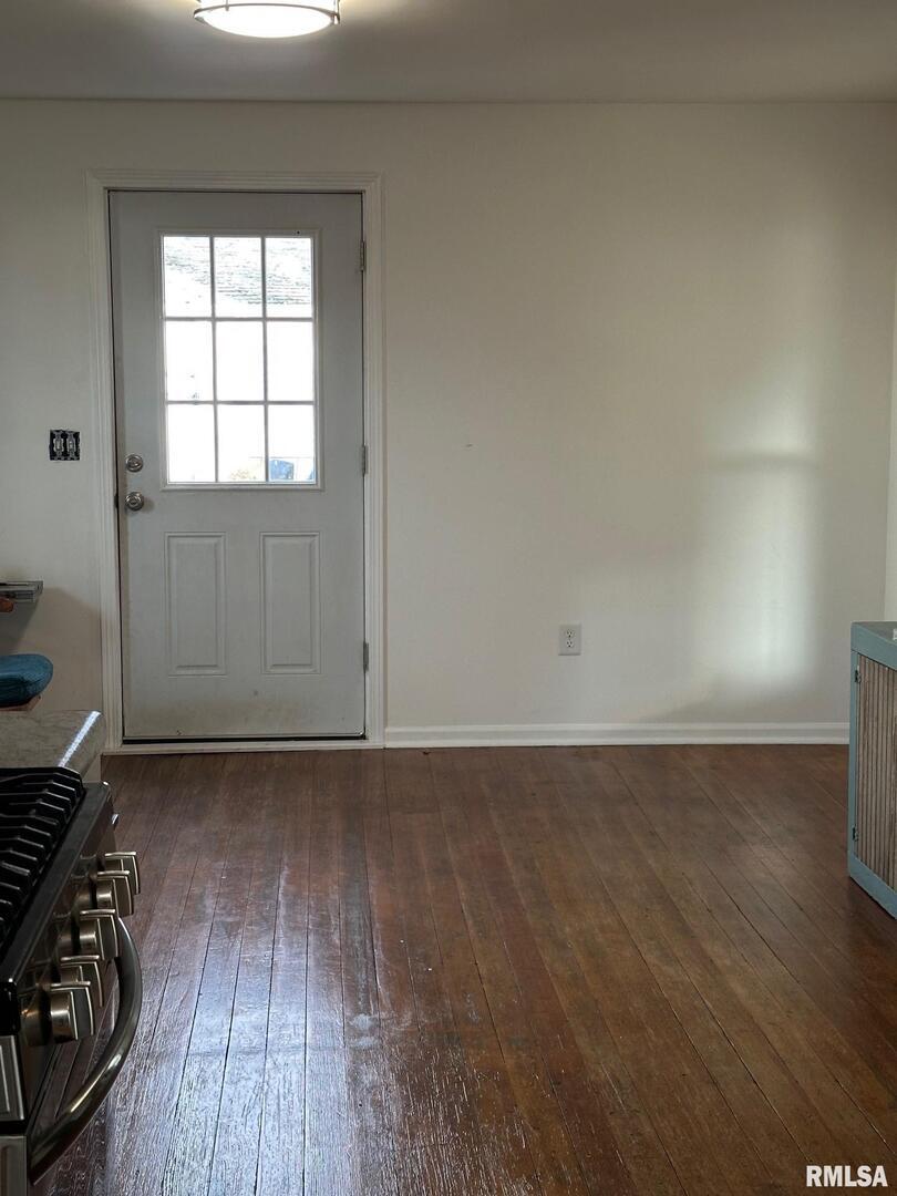 323 Lincoln Street Miles, IA 52064 - Photo 31 of 34 an empty room with wooden floor and windows