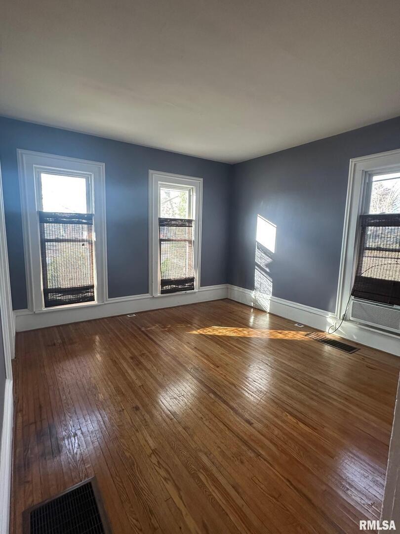 323 Lincoln Street Miles, IA 52064 - Photo 5 of 34 a view of empty room with wooden floor and fan
