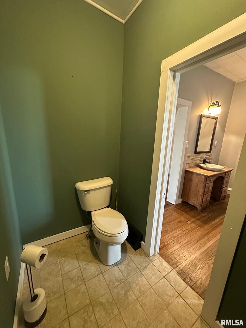 323 Lincoln Street Miles, IA 52064 - Photo 10 of 34 a bathroom with a toilet