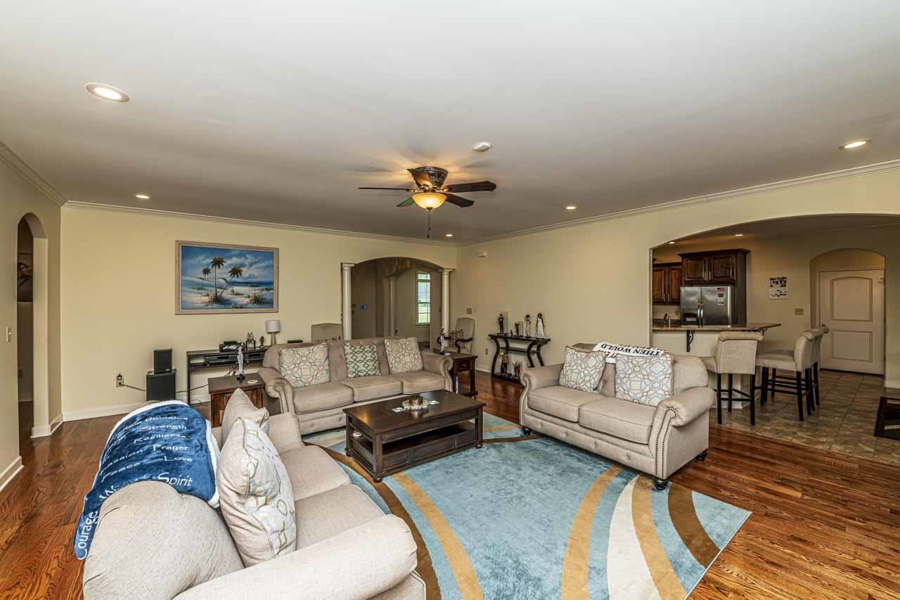185 Belmont Road Mason, TN 38049 - Photo 11 of 38 Spacious common area featuring wood-finish flooring, recessed lighting, and crown molding