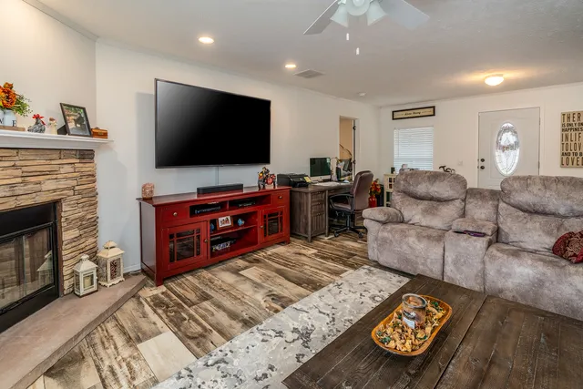a living room with furniture and a flat screen tv
