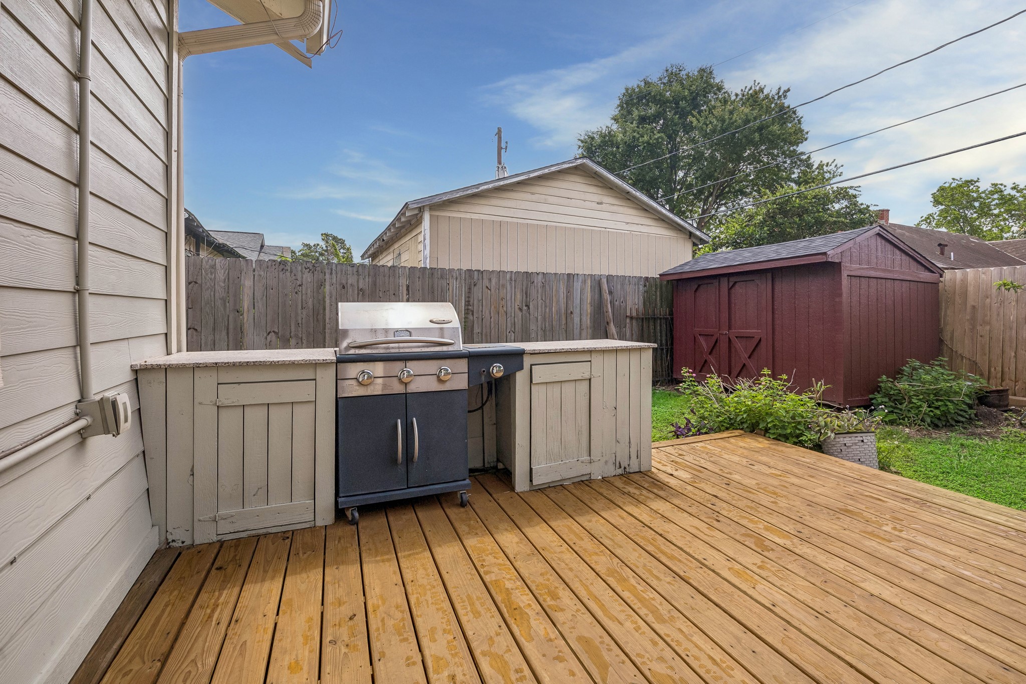 4412 Rusk Street Houston, TX 77023 - Photo 33 of 44 Cooking & entertaining has never been easier with this built-in grill & freshly refurbished deck. Note storage shed tucked away in the corner of the yard, offering the excellent storage for outdoor essentials.