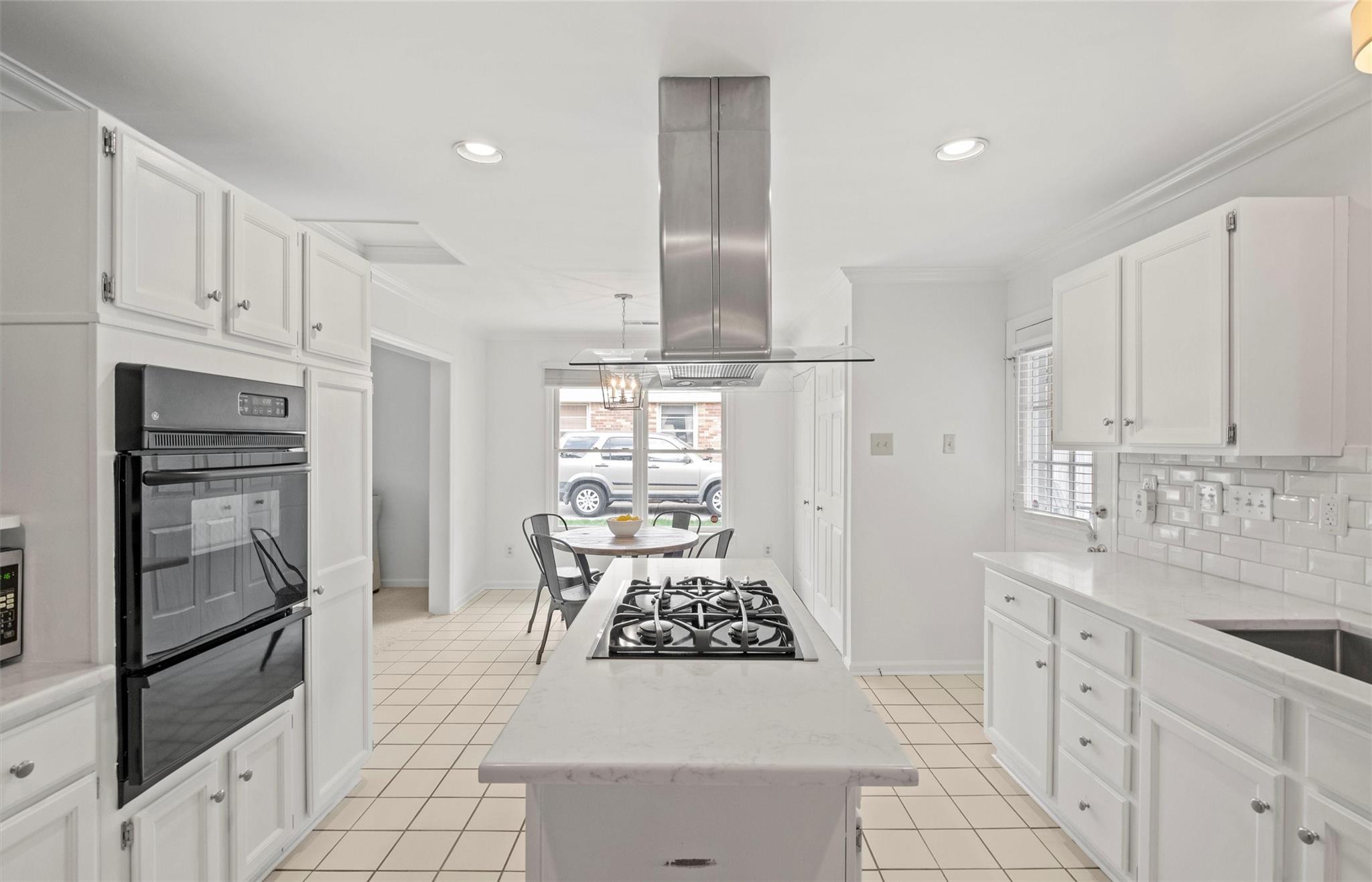 245 Scofield Road Charlotte, NC 28209 - Photo 13 of 33 a kitchen with white cabinets and appliances