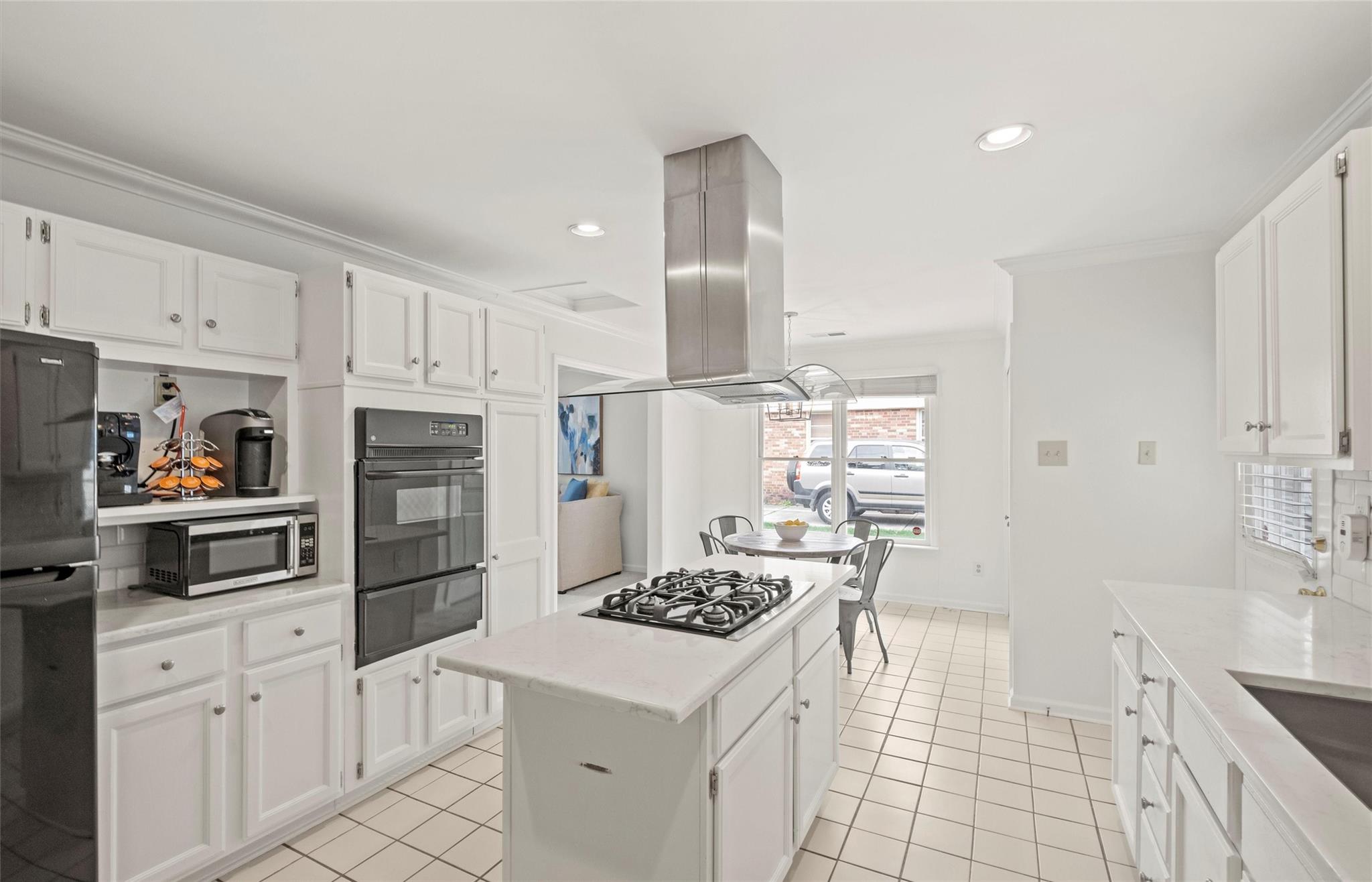 245 Scofield Road Charlotte, NC 28209 - Photo 14 of 33 a kitchen with white cabinets and appliances