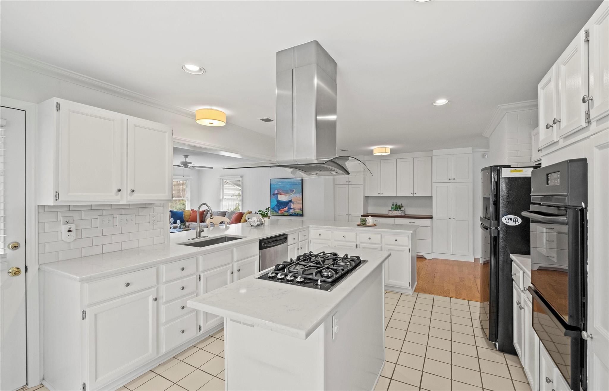 245 Scofield Road Charlotte, NC 28209 - Photo 16 of 33 a kitchen with white cabinets and stainless steel appliances