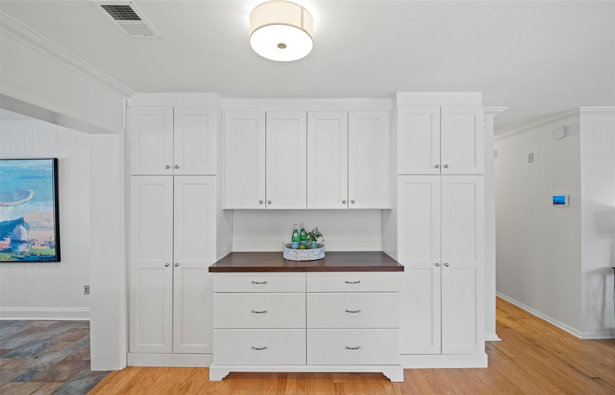 245 Scofield Road Charlotte, NC 28209 - Photo 17 of 33 a kitchen with white cabinets and stainless steel appliances