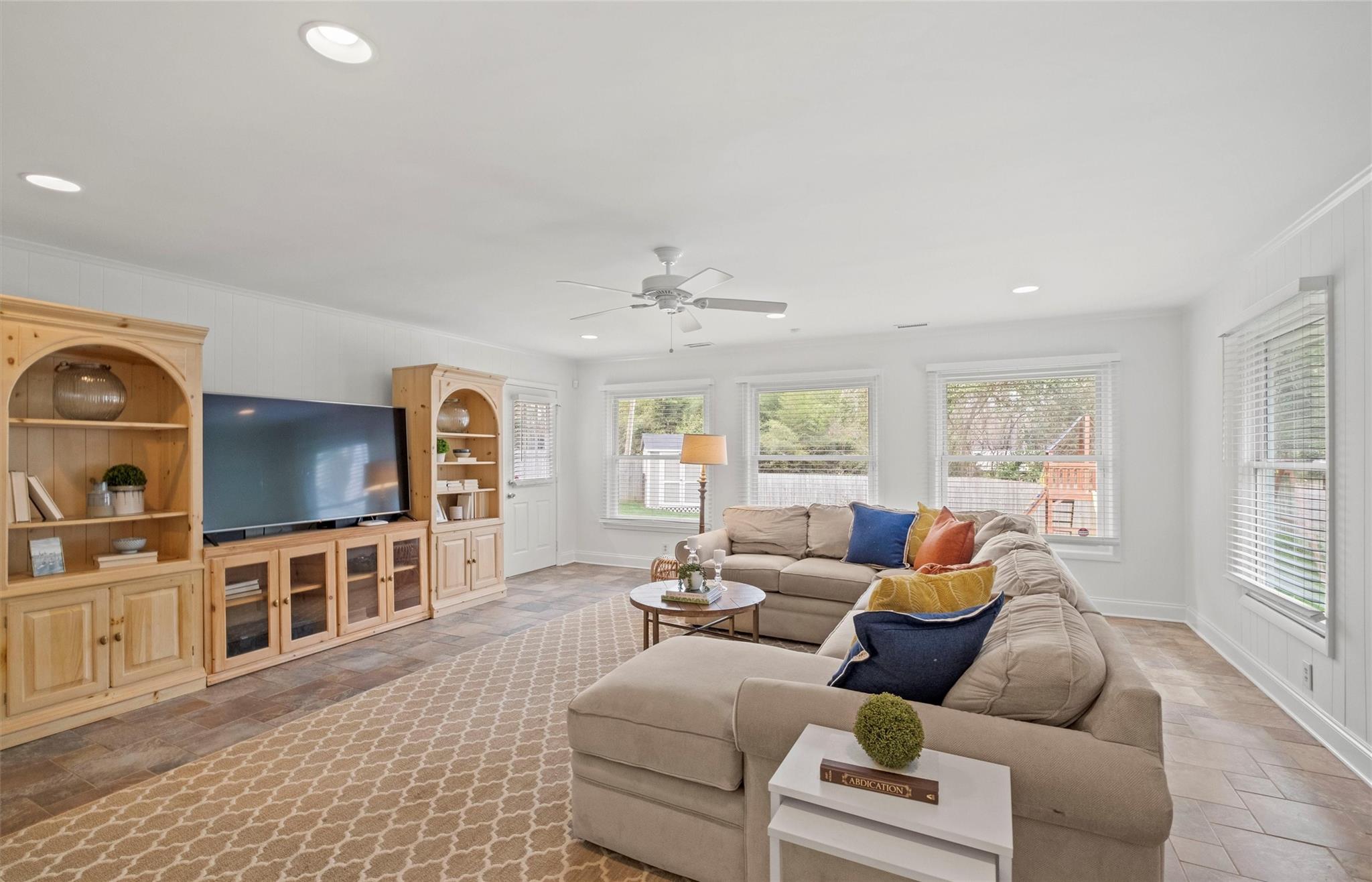 245 Scofield Road Charlotte, NC 28209 - Photo 19 of 33 a living room with furniture and a flat screen tv