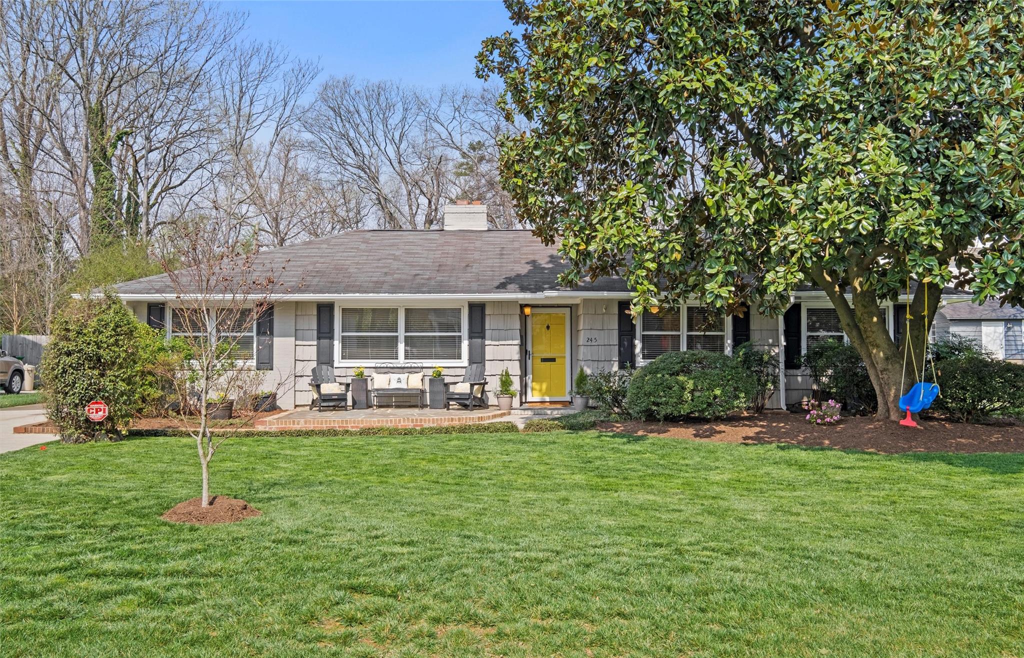 245 Scofield Road Charlotte, NC 28209 - Photo 2 of 33 a house view with a sitting space and garden view