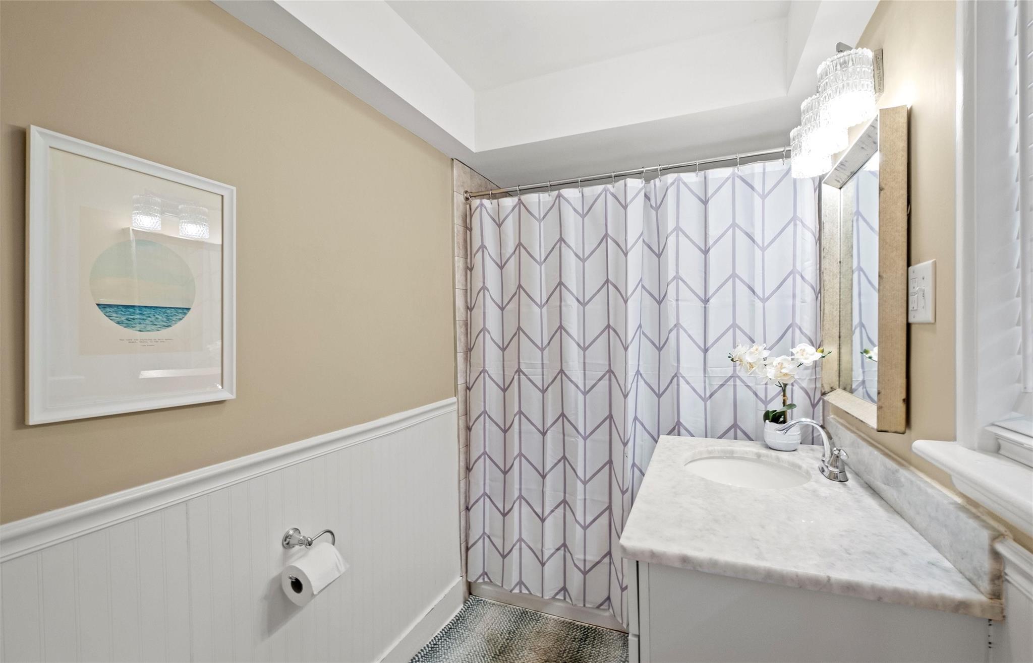 245 Scofield Road Charlotte, NC 28209 - Photo 27 of 33 a bathroom with a sink and a mirror