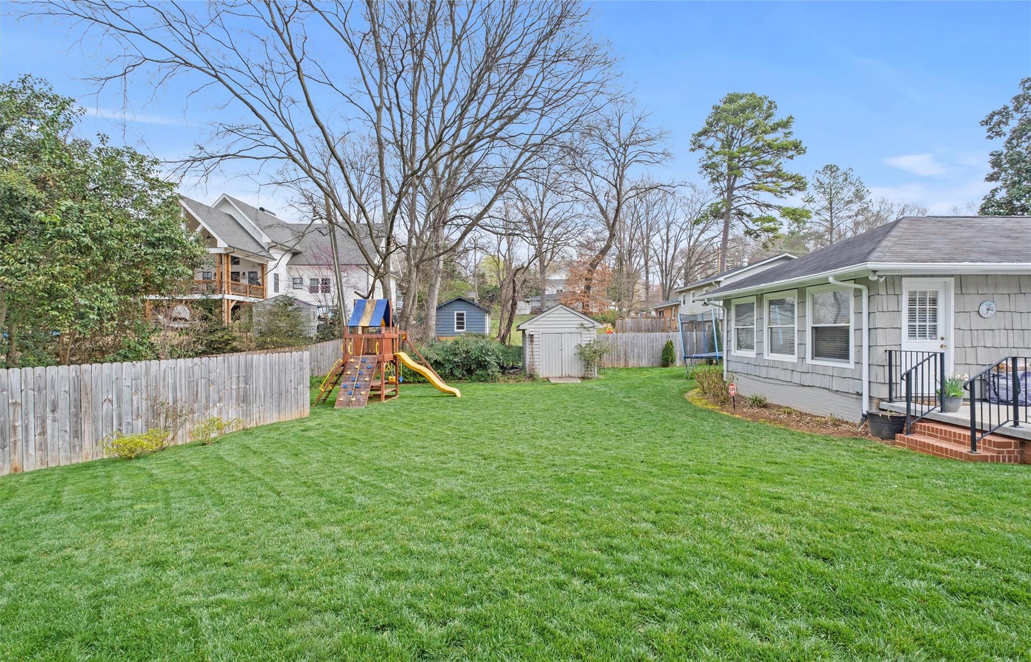 245 Scofield Road Charlotte, NC 28209 - Photo 31 of 33 a view of a house with a yard and sitting area