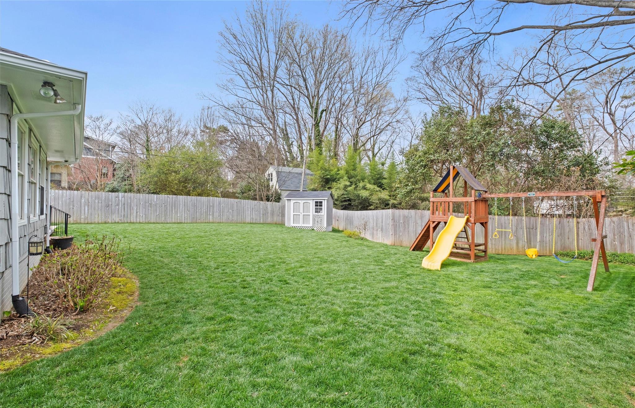 245 Scofield Road Charlotte, NC 28209 - Photo 33 of 33 a view of a house with a slide and a tree