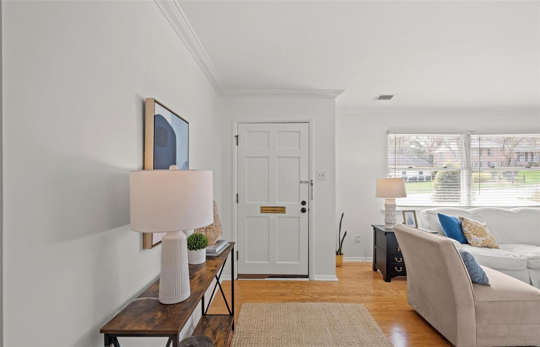 245 Scofield Road Charlotte, NC 28209 - Photo 5 of 33 a living room with furniture a window and a potted plant