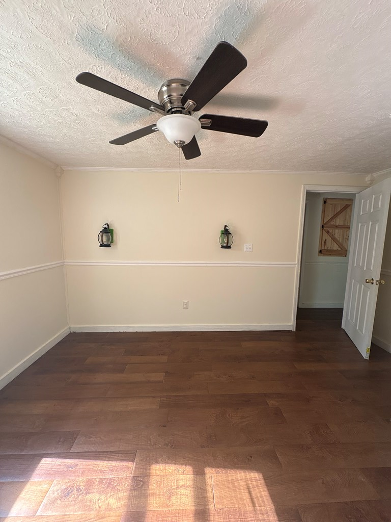 2910 Beech Street Columbus, GA 31909 - Photo 12 of 24 a view of a room with wooden floor and a ceiling fan