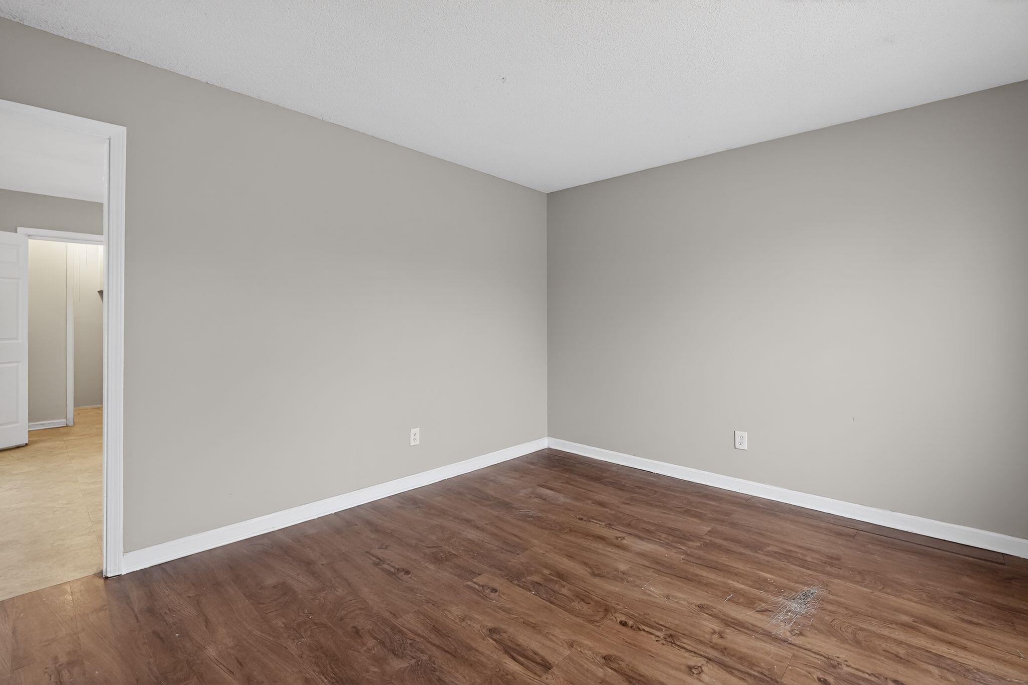 4094 Double Tree Street Memphis, TN 38109 - Photo 13 of 31 Unfurnished room with dark wood finished floors and baseboards