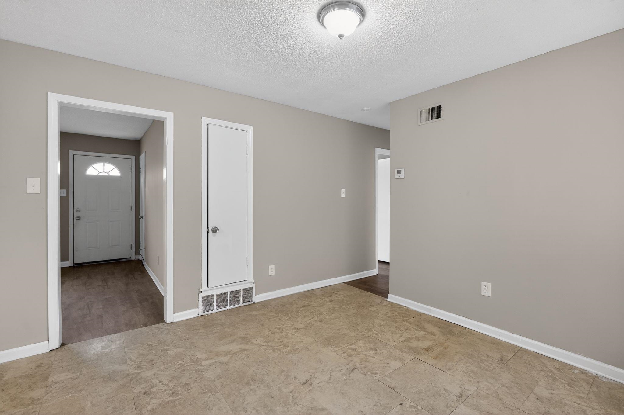 4094 Double Tree Street Memphis, TN 38109 - Photo 16 of 31 Empty room featuring baseboards and a textured ceiling