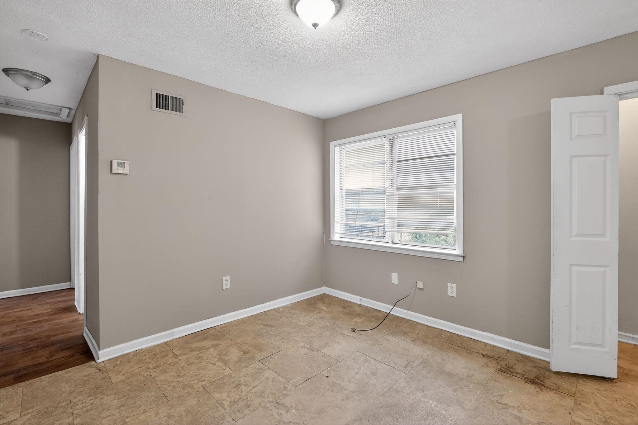 4094 Double Tree Street Memphis, TN 38109 - Photo 26 of 31 Unfurnished bedroom with a textured ceiling and baseboards