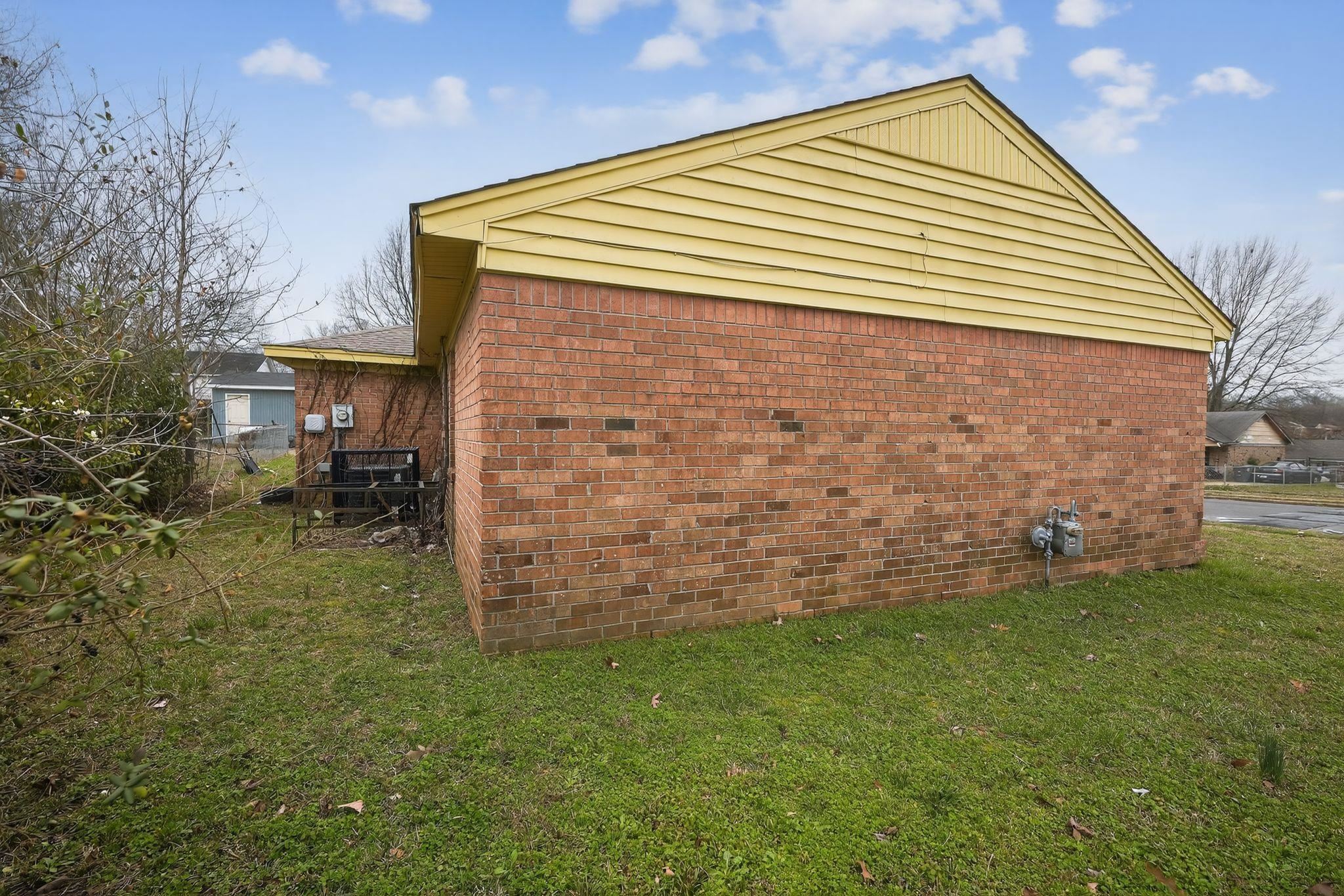 4094 Double Tree Street Memphis, TN 38109 - Photo 3 of 31 View of side of home featuring brick siding and a cooling unit