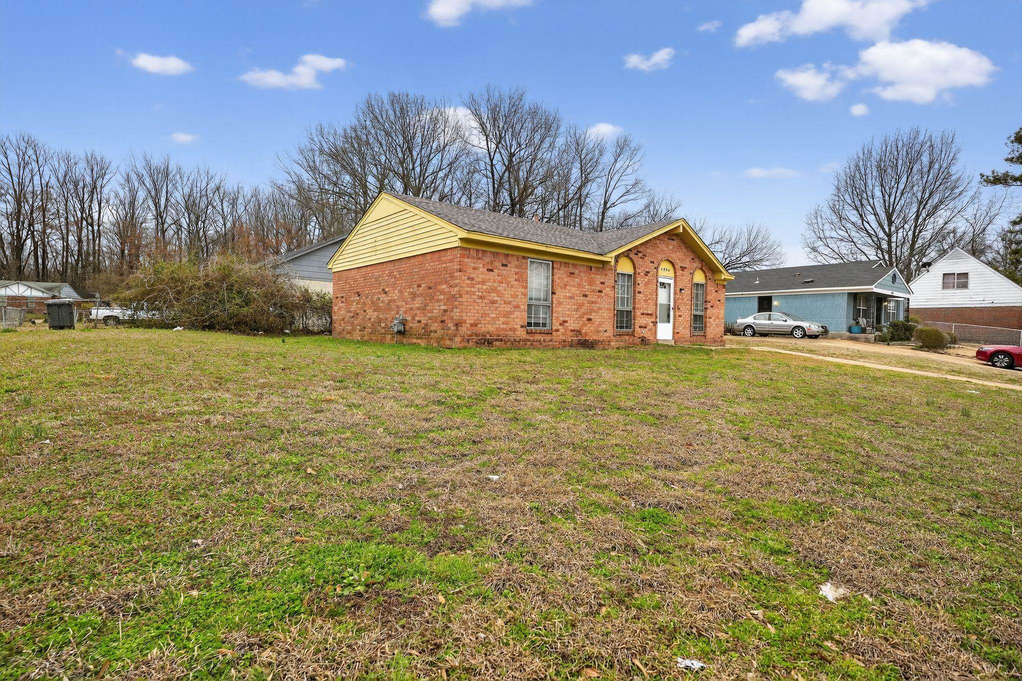 4094 Double Tree Street Memphis, TN 38109 - Photo 7 of 31 View of side of home with brick siding and a lawn
