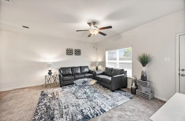 a living room with furniture and a window
