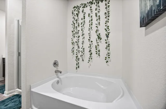 a white bath tub sitting in a bathroom