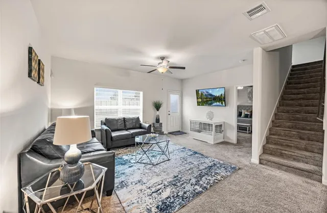 a living room with furniture and a window