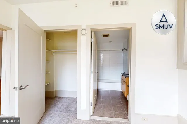 a view of a bathroom from a hallway