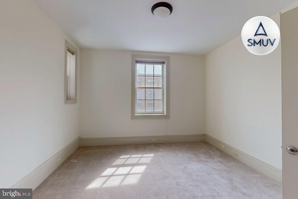11 East Chase Street, Unit 506 Baltimore, MD 21202 - Photo 14 of 32 Bright and airy room with natural light.