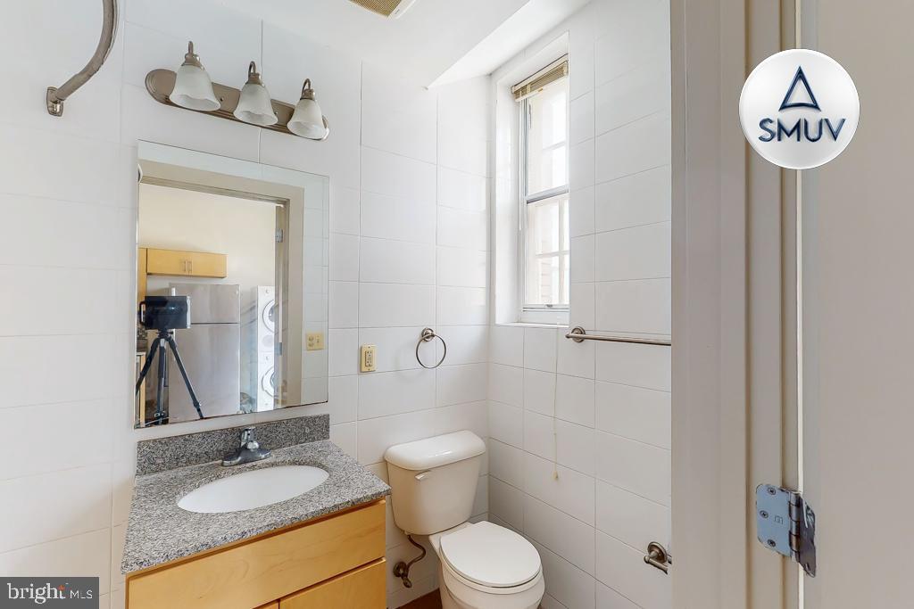 11 East Chase Street, Unit 506 Baltimore, MD 21202 - Photo 15 of 32 Bright and airy bathroom with modern finishes.